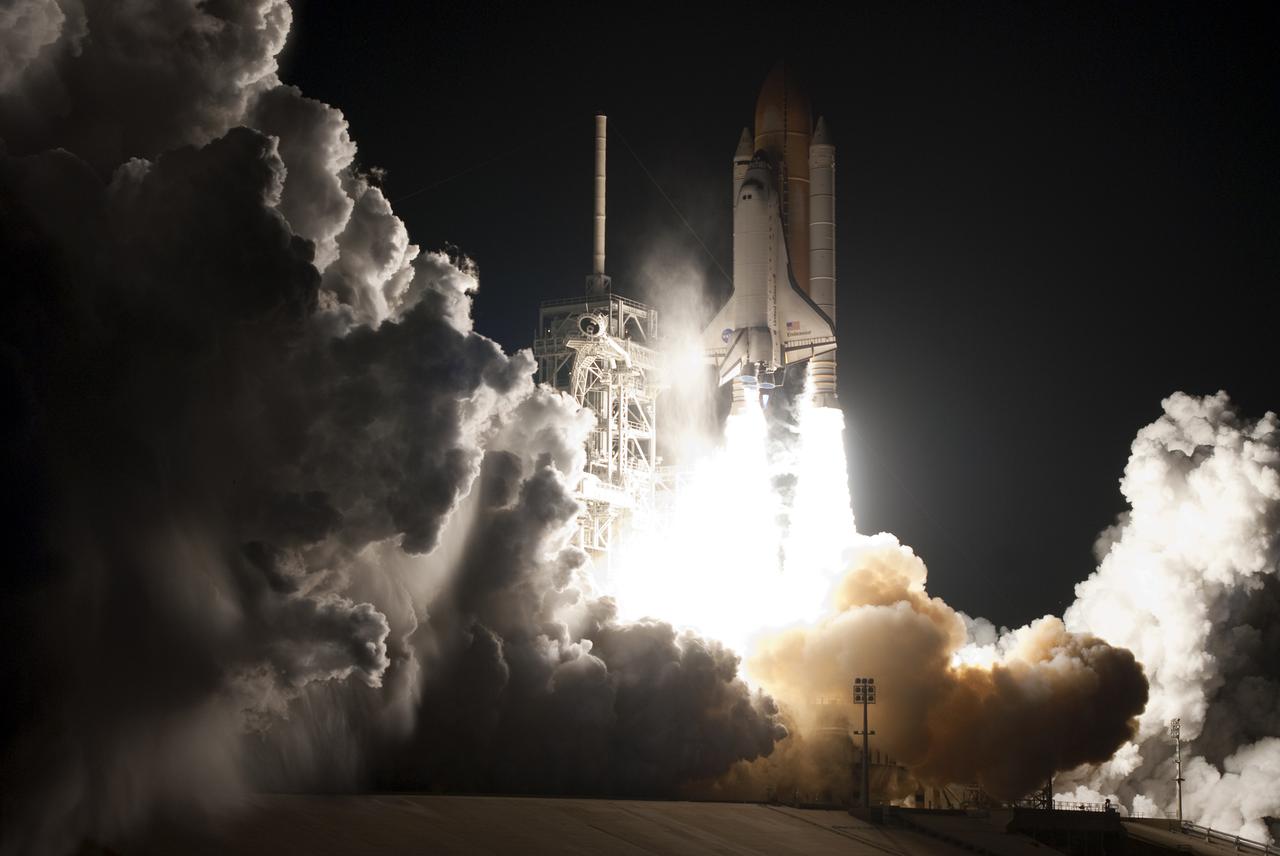 CAPE CANAVERAL, Fla. - An exhaust cloud billows at Launch Pad 39A at NASA's Kennedy Space Center in Florida as space shuttle Endeavour lifts off into the night sky.  Launch of the STS-130 mission to the International Space Station was at 4:14 a.m. EST.  This was the second launch attempt for space shuttle Endeavour's STS-130 crew and the final scheduled space shuttle night launch.  The first attempt on Feb. 7 was scrubbed due to unfavorable weather. The primary payload for the STS-130 mission to the International Space Station is the Tranquility node, a pressurized module that will provide additional room for crew members and many of the station's life support and environmental control systems. Attached to one end of Tranquility is a cupola, a unique work area with six windows on its sides and one on top.  The cupola resembles a circular bay window and will provide a vastly improved view of the station's exterior. The multi-directional view will allow the crew to monitor spacewalks and docking operations, as well as provide a spectacular view of Earth and other celestial objects. The module was built in Turin, Italy, by Thales Alenia Space for the European Space Agency.  For information on the STS-130 mission and crew, visit http:__www.nasa.gov_mission_pages_shuttle_shuttlemissions_sts130_index.html.  Photo credit: NASA_Sandra Joseph and Kevin O'Connell
