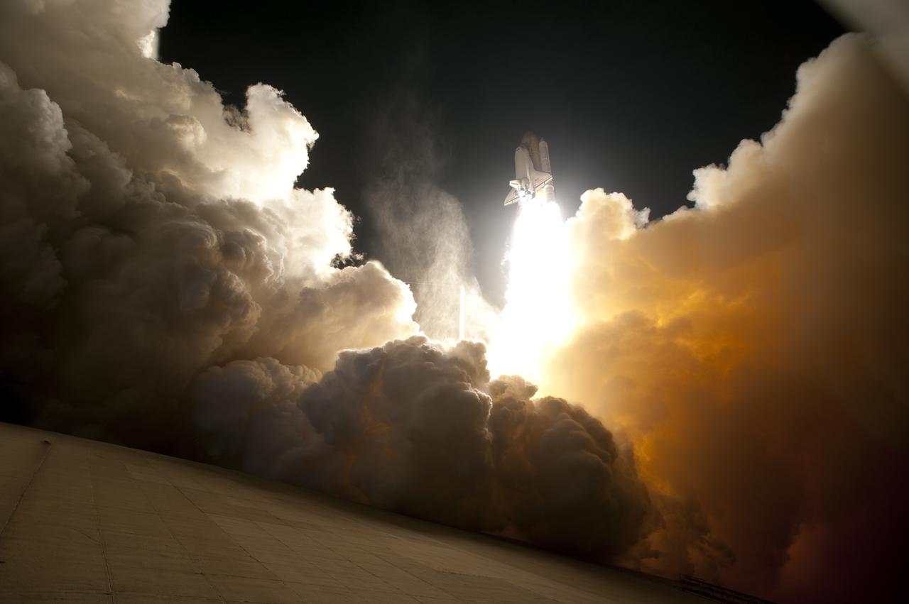 CAPE CANAVERAL, Fla. - An exhaust cloud engulfs Launch Pad 39A at NASA's Kennedy Space Center in Florida as space shuttle Endeavour lifts off into the night sky.  Launch of the STS-130 mission to the International Space Station was at 4:14 a.m. EST.  This was the second launch attempt for space shuttle Endeavour's STS-130 crew and the final scheduled space shuttle night launch.  The first attempt on Feb. 7 was scrubbed due to unfavorable weather. The primary payload for the STS-130 mission to the International Space Station is the Tranquility node, a pressurized module that will provide additional room for crew members and many of the station's life support and environmental control systems. Attached to one end of Tranquility is a cupola, a unique work area with six windows on its sides and one on top.  The cupola resembles a circular bay window and will provide a vastly improved view of the station's exterior. The multi-directional view will allow the crew to monitor spacewalks and docking operations, as well as provide a spectacular view of Earth and other celestial objects. The module was built in Turin, Italy, by Thales Alenia Space for the European Space Agency.  For information on the STS-130 mission and crew, visit http:__www.nasa.gov_mission_pages_shuttle_shuttlemissions_sts130_index.html.  Photo credit: NASA_Sandra Joseph and Kevin O'Connell