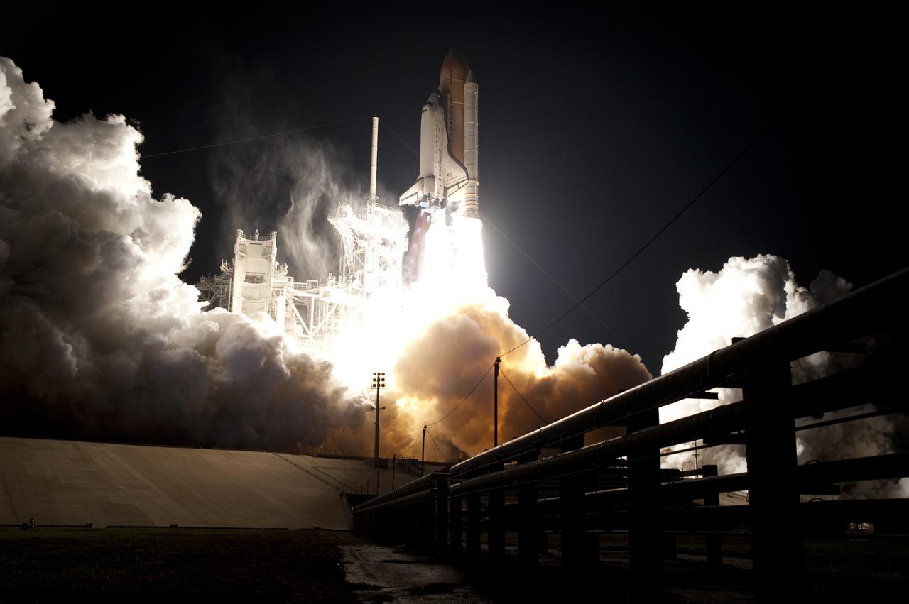 CAPE CANAVERAL, Fla. - An exhaust cloud builds at Launch Pad 39A at NASA's Kennedy Space Center in Florida as space shuttle Endeavour lifts off into the night sky.  Launch of the STS-130 mission to the International Space Station was at 4:14 a.m. EST.  This was the second launch attempt for space shuttle Endeavour's STS-130 crew and the final scheduled space shuttle night launch.  The first attempt on Feb. 7 was scrubbed due to unfavorable weather. The primary payload for the STS-130 mission to the International Space Station is the Tranquility node, a pressurized module that will provide additional room for crew members and many of the station's life support and environmental control systems. Attached to one end of Tranquility is a cupola, a unique work area with six windows on its sides and one on top.  The cupola resembles a circular bay window and will provide a vastly improved view of the station's exterior. The multi-directional view will allow the crew to monitor spacewalks and docking operations, as well as provide a spectacular view of Earth and other celestial objects. The module was built in Turin, Italy, by Thales Alenia Space for the European Space Agency.  For information on the STS-130 mission and crew, visit http:__www.nasa.gov_mission_pages_shuttle_shuttlemissions_sts130_index.html.  Photo credit: NASA_Sandra Joseph and Kevin O'Connell