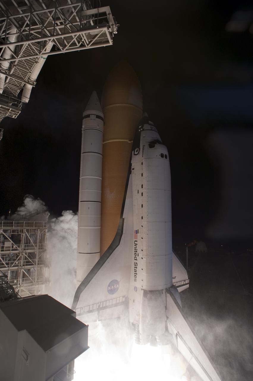 CAPE CANAVERAL, Fla. - An exhaust cloud forms under space shuttle Endeavour as it begins its climb to orbit from Launch Pad 39A at NASA's Kennedy Space Center in Florida.  Launch of the STS-130 mission to the International Space Station was at 4:14 a.m. EST.  This was the second launch attempt for space shuttle Endeavour's STS-130 crew and the final scheduled space shuttle night launch.  The first attempt on Feb. 7 was scrubbed due to unfavorable weather. The primary payload for the STS-130 mission to the International Space Station is the Tranquility node, a pressurized module that will provide additional room for crew members and many of the station's life support and environmental control systems. Attached to one end of Tranquility is a cupola, a unique work area with six windows on its sides and one on top.  The cupola resembles a circular bay window and will provide a vastly improved view of the station's exterior. The multi-directional view will allow the crew to monitor spacewalks and docking operations, as well as provide a spectacular view of Earth and other celestial objects. The module was built in Turin, Italy, by Thales Alenia Space for the European Space Agency.  For information on the STS-130 mission and crew, visit http:__www.nasa.gov_mission_pages_shuttle_shuttlemissions_sts130_index.html.  Photo credit: Photo credit: NASA_Sandra Joseph and Kevin O'Connell