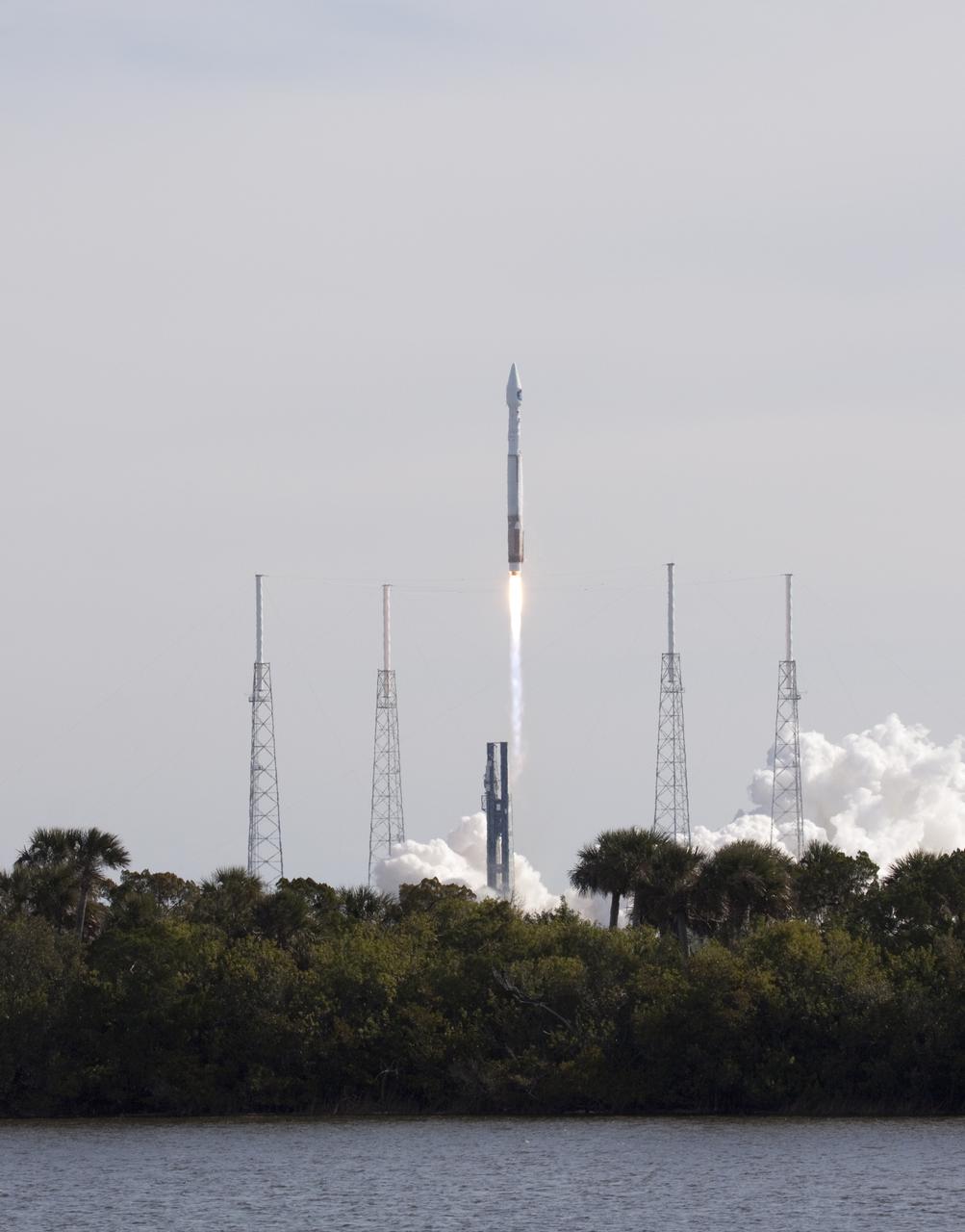 CAPE CANAVERAL, Fla. – A United Launch Alliance Atlas V rocket lifts off over the treetops at Launch Complex 41 on Cape Canaveral Air Force Station at 10:23 a.m. EST Feb. 11 carrying NASA's Solar Dynamics Observatory to orbit.   This is the 100th launch of a commercial Atlas_Centaur rocket.  The observatory, known as SDO, is the first mission in NASA's Living With a Star Program and is designed to study the causes of solar variability and its impacts on Earth. The spacecraft's long-term measurements will give solar scientists in-depth information to help characterize the interior of the Sun, the Sun's magnetic field, the hot plasma of the solar corona, and the density of radiation that creates the ionosphere of the planets. The information will be used to create better forecasts of space weather needed to protect the aircraft, satellites and astronauts living and working in space. For information on SDO, visit http:__www.nasa.gov_sdo.  Photo credit: NASA_Jack Pfaller