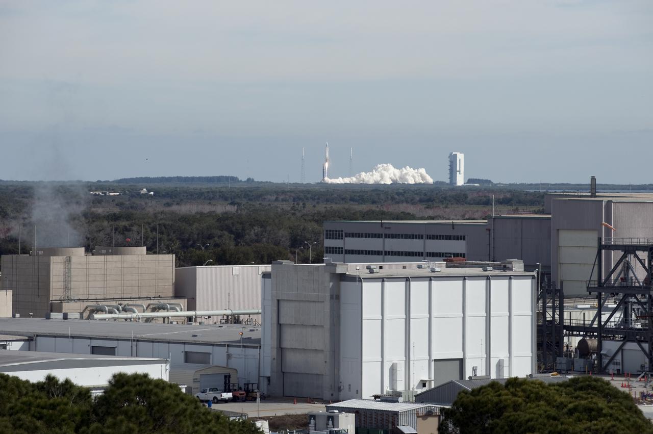CAPE CANAVERAL, Fla. – A rooftop in the Industrial Area of NASA's Kennedy Space Center provides a bird's-eye view of the liftoff of the United Launch Alliance Atlas V rocket carrying NASA's Solar Dynamics Observatory from Launch Complex 41 on Cape Canaveral Air Force Station. Launch was at 10:23 a.m. EST Feb. 11. This is the 100th launch of a commercial Atlas_Centaur rocket. The observatory, known as SDO, is the first mission in NASA's Living With a Star Program and is designed to study the causes of solar variability and its impacts on Earth. The spacecraft's long-term measurements will give solar scientists in-depth information to help characterize the interior of the Sun, the Sun's magnetic field, the hot plasma of the solar corona, and the density of radiation that creates the ionosphere of the planets. The information will be used to create better forecasts of space weather needed to protect the aircraft, satellites and astronauts living and working in space. For information on SDO, visit http:__www.nasa.gov_sdo. Photo credit: NASA_Tony Gray