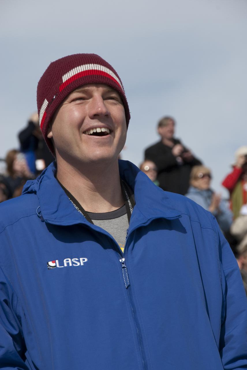 CAPE CANAVERAL, Fla. – Phillip Chamberlin, NASA Goddard Space Flight Center deputy project scientist for the Solar Dynamics Observatory, enjoys watching its launch from the Banana Creek viewing site at NASA's Kennedy Space Center in Florida.  Liftoff from Launch Complex 41 on Cape Canaveral Air Force Station aboard a United Launch Alliance Atlas V rocket was at 10:23 a.m. EST Feb. 11. This is the 100th launch of a commercial Atlas_Centaur rocket.  The observatory, known as SDO, is the first mission in NASA's Living With a Star Program and is designed to study the causes of solar variability and its impacts on Earth. The spacecraft's long-term measurements will give solar scientists in-depth information to help characterize the interior of the Sun, the Sun's magnetic field, the hot plasma of the solar corona, and the density of radiation that creates the ionosphere of the planets. The information will be used to create better forecasts of space weather needed to protect the aircraft, satellites and astronauts living and working in space. For information on SDO, visit http:__www.nasa.gov_sdo.  Photo credit: NASA_Kim Shiflett