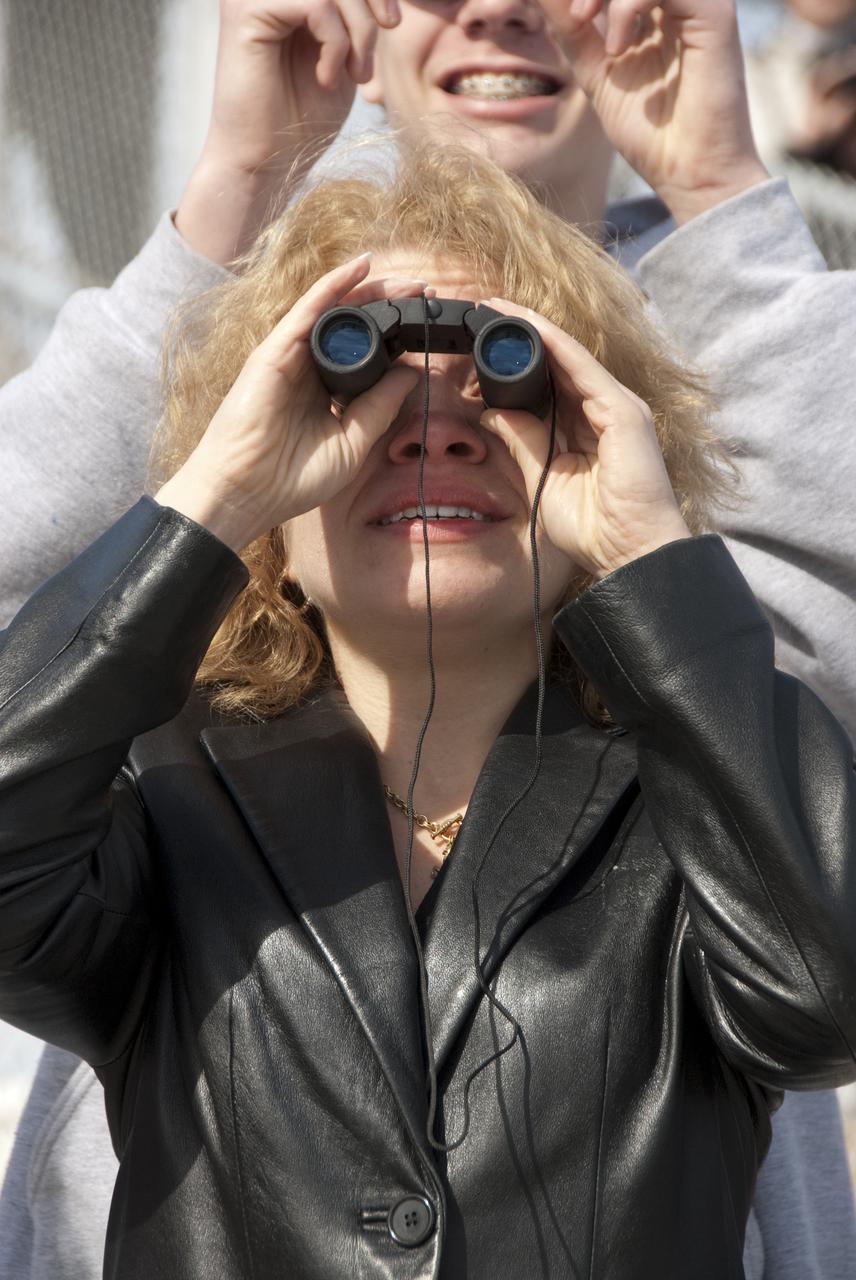 CAPE CANAVERAL, Fla. – Barbara Thompson, NASA Goddard Space Flight Center deputy project scientist for the Solar Dynamics Observatory, watches its launch from the Banana Creek viewing site at NASA's Kennedy Space Center in Florida.  Liftoff from Launch Complex 41 on Cape Canaveral Air Force Station aboard a United Launch Alliance Atlas V rocket was at 10:23 a.m. EST Feb. 11. This is the 100th launch of a commercial Atlas_Centaur rocket.  The observatory, known as SDO, is the first mission in NASA's Living With a Star Program and is designed to study the causes of solar variability and its impacts on Earth. The spacecraft's long-term measurements will give solar scientists in-depth information to help characterize the interior of the Sun, the Sun's magnetic field, the hot plasma of the solar corona, and the density of radiation that creates the ionosphere of the planets. The information will be used to create better forecasts of space weather needed to protect the aircraft, satellites and astronauts living and working in space. For information on SDO, visit http:__www.nasa.gov_sdo.  Photo credit: NASA_Kim Shiflett