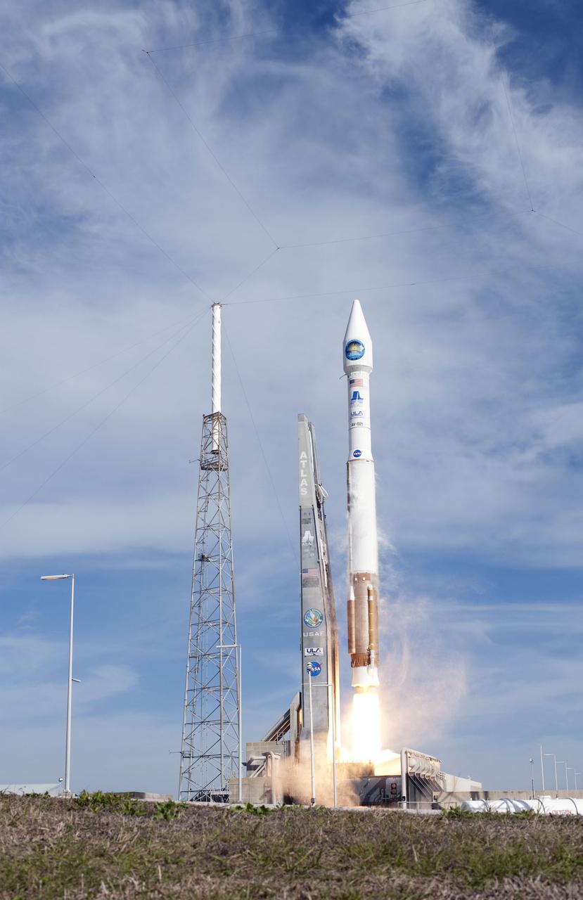 CAPE CANAVERAL, Fla. – The United Launch Alliance Atlas V rocket carrying NASA's Solar Dynamics Observatory lifts off into thin upper-level clouds over Launch Complex 41 on Cape Canaveral Air Force Station to deliver its payload to orbit. Launch was at 10:23 a.m. EST Feb. 11. This is the 100th launch of a commercial Atlas_Centaur rocket. The observatory, known as SDO, is the first mission in NASA's Living With a Star Program and is designed to study the causes of solar variability and its impacts on Earth. The spacecraft's long-term measurements will give solar scientists in-depth information to help characterize the interior of the Sun, the Sun's magnetic field, the hot plasma of the solar corona, and the density of radiation that creates the ionosphere of the planets. The information will be used to create better forecasts of space weather needed to protect the aircraft, satellites and astronauts living and working in space. For information on SDO, visit http:__www.nasa.gov_sdo. Photo credit: NASA_Sandra Joseph and Tony Gray