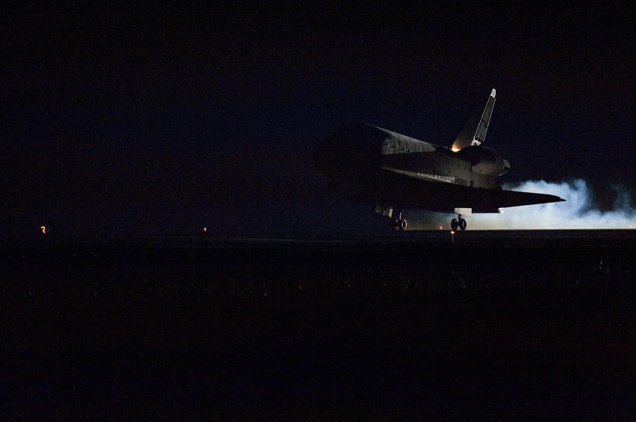 CAPE CANAVERAL, Fla. - Touchdown is apparent by the streams of smoke trailing space shuttle Endeavour as its main landing gear tires contact Runway 15 at the Shuttle Landing Facility at NASA's Kennedy Space Center in Florida. After 14 days in space, Endeavour's 5.7-million-mile STS-130 mission is completed on orbit 217.  Main gear touchdown was at 10:20:31 p.m. EST followed by nose gear touchdown at 10:20:39 p.m. and wheels stop at 10:22:10 p.m.  It was the 23rd night landing in shuttle history and the 17th at Kennedy.  Aboard are Commander George Zamka; Pilot Terry Virts; and Mission Specialists Robert Behnken, Nicholas Patrick, Kathryn Hire and Stephen Robinson.  During Endeavour's STS-130 mission, astronauts installed the Tranquility node, a module that provides additional room for crew members and many of the station's life support and environmental control systems. Attached to Tranquility is a cupola with seven windows that provide a panoramic view of Earth, celestial objects and visiting spacecraft. The module was built in Turin, Italy, by Thales Alenia Space for the European Space Agency.  The orbiting laboratory is approximately 90 percent complete now in terms of mass.  STS-130 was the 24th flight for Endeavour, the 32nd shuttle mission devoted to ISS assembly and maintenance, and the 130th shuttle mission to date.  For information on the STS-130 mission and crew, visit http:__www.nasa.gov_mission_pages_shuttle_shuttlemissions_sts130_index.html.  Photo credit: NASA_Chuck Tintera