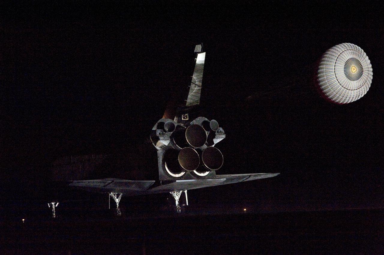 CAPE CANAVERAL, Fla. - Darkness shrouds space shuttle Endeavour as it touches down on Runway 15 at the Shuttle Landing Facility at NASA's Kennedy Space Center in Florida.  After 14 days in space, Endeavour's 5.7-million-mile STS-130 mission is completed on orbit 217.  Main gear touchdown was at 10:20:31 p.m. EST followed by nose gear touchdown at 10:20:39 p.m. and wheels stop at 10:22:10 p.m.  It was the 23rd night landing in shuttle history and the 17th at Kennedy.  Aboard are Commander George Zamka; Pilot Terry Virts; and Mission Specialists Robert Behnken, Nicholas Patrick, Kathryn Hire and Stephen Robinson.  During Endeavour's STS-130 mission, astronauts installed the Tranquility node, a module that provides additional room for crew members and many of the station's life support and environmental control systems. Attached to Tranquility is a cupola with seven windows that provide a panoramic view of Earth, celestial objects and visiting spacecraft. The module was built in Turin, Italy, by Thales Alenia Space for the European Space Agency.  The orbiting laboratory is approximately 90 percent complete now in terms of mass.  STS-130 was the 24th flight for Endeavour, the 32nd shuttle mission devoted to ISS assembly and maintenance, and the 130th shuttle mission to date.  For information on the STS-130 mission and crew, visit http:__www.nasa.gov_mission_pages_shuttle_shuttlemissions_sts130_index.html.  Photo credit: NASA_Tom Joseph