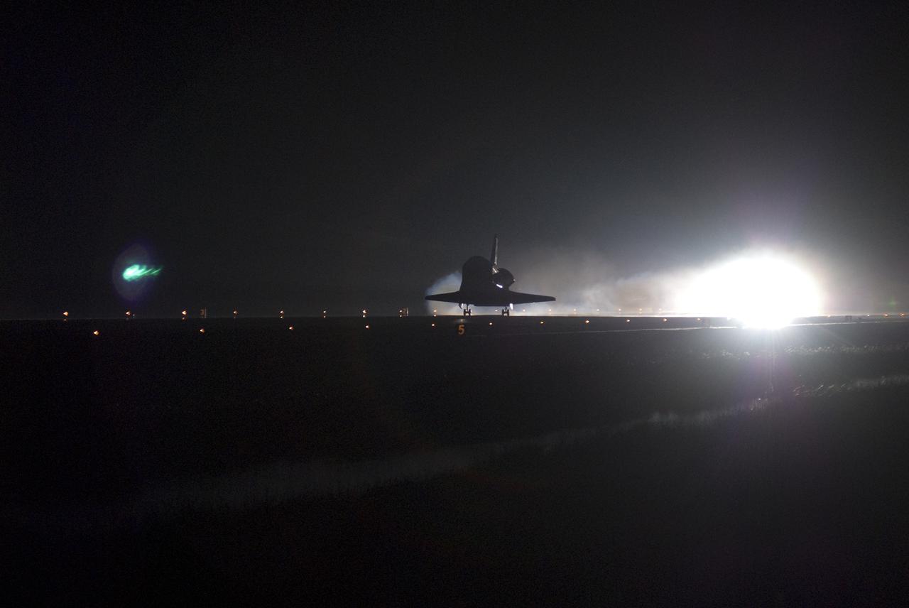 CAPE CANAVERAL, Fla. - STS-130 Commander George Zamka sets space shuttle Endeavour down in the middle of Runway 15 at the Shuttle Landing Facility at NASA's Kennedy Space Center in Florida.  After 14 days in space, Endeavour's 5.7-million-mile STS-130 mission is completed on orbit 217.  Main gear touchdown was at 10:20:31 p.m. EST followed by nose gear touchdown at 10:20:39 p.m. and wheels stop at 10:22:10 p.m.  It was the 23rd night landing in shuttle history and the 17th at Kennedy.  Aboard are Commander George Zamka; Pilot Terry Virts; and Mission Specialists Robert Behnken, Nicholas Patrick, Kathryn Hire and Stephen Robinson.  During Endeavour's STS-130 mission, astronauts installed the Tranquility node, a module that provides additional room for crew members and many of the station's life support and environmental control systems. Attached to Tranquility is a cupola with seven windows that provide a panoramic view of Earth, celestial objects and visiting spacecraft. The module was built in Turin, Italy, by Thales Alenia Space for the European Space Agency.  The orbiting laboratory is approximately 90 percent complete now in terms of mass.  STS-130 was the 24th flight for Endeavour, the 32nd shuttle mission devoted to ISS assembly and maintenance, and the 130th shuttle mission to date.  For information on the STS-130 mission and crew, visit http:__www.nasa.gov_mission_pages_shuttle_shuttlemissions_sts130_index.html.  Photo credit: NASA_Jim Grossmann