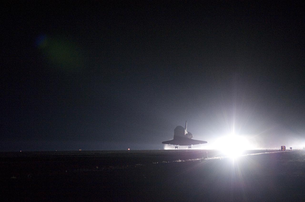 CAPE CANAVERAL, Fla. - The xenon lights at the Shuttle Landing Facility at NASA's Kennedy Space Center in Florida reveal space shuttle Endeavour nearing touchdown on Runway 15. After 14 days in space, Endeavour's 5.7-million-mile STS-130 mission is completed on orbit 217.  Main gear touchdown was at 10:20:31 p.m. EST followed by nose gear touchdown at 10:20:39 p.m. and wheels stop at 10:22:10 p.m.  It was the 23rd night landing in shuttle history and the 17th at Kennedy.  Aboard are Commander George Zamka; Pilot Terry Virts; and Mission Specialists Robert Behnken, Nicholas Patrick, Kathryn Hire and Stephen Robinson.  During Endeavour's STS-130 mission, astronauts installed the Tranquility node, a module that provides additional room for crew members and many of the station's life support and environmental control systems. Attached to Tranquility is a cupola with seven windows that provide a panoramic view of Earth, celestial objects and visiting spacecraft. The module was built in Turin, Italy, by Thales Alenia Space for the European Space Agency.  The orbiting laboratory is approximately 90 percent complete now in terms of mass.  STS-130 was the 24th flight for Endeavour, the 32nd shuttle mission devoted to ISS assembly and maintenance, and the 130th shuttle mission to date.  For information on the STS-130 mission and crew, visit http:__www.nasa.gov_mission_pages_shuttle_shuttlemissions_sts130.  Photo credit: NASA_Sandra Joseph and Kevin O'Connell