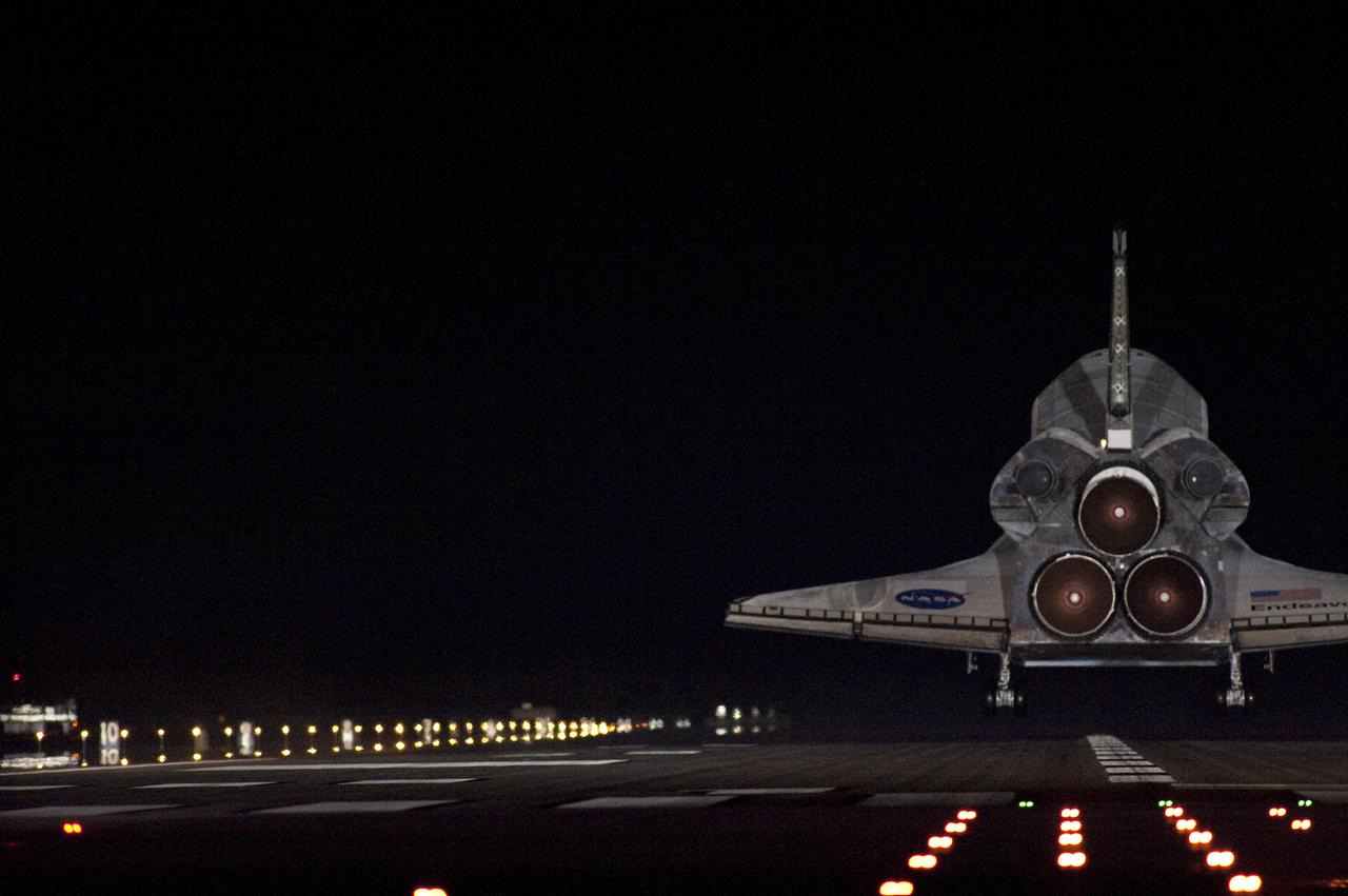 CAPE CANAVERAL, Fla. - Under the veil of darkness, space shuttle Endeavour nears touchdown on Runway 15 at the Shuttle Landing Facility at NASA's Kennedy Space Center in Florida after 14 days in space, completing the 5.7-million-mile STS-130 mission to the International Space Station on orbit 217.  Main gear touchdown was at 10:20:31 p.m. EST followed by nose gear touchdown at 10:20:39 p.m. and wheels stop at 10:22:10 p.m.  It was the 23rd night landing in shuttle history and the 17th at Kennedy.  Aboard are Commander George Zamka; Pilot Terry Virts; and Mission Specialists Robert Behnken, Nicholas Patrick, Kathryn Hire and Stephen Robinson.  During Endeavour's STS-130 mission, astronauts installed the Tranquility node, a module that provides additional room for crew members and many of the station's life support and environmental control systems. Attached to Tranquility is a cupola with seven windows that provide a panoramic view of Earth, celestial objects and visiting spacecraft. The module was built in Turin, Italy, by Thales Alenia Space for the European Space Agency.  The orbiting laboratory is approximately 90 percent complete now in terms of mass.  STS-130 was the 24th flight for Endeavour, the 32nd shuttle mission devoted to ISS assembly and maintenance, and the 130th shuttle mission to date.  For information on the STS-130 mission and crew, visit http:__www.nasa.gov_mission_pages_shuttle_shuttlemissions_sts130.  Photo credit: NASA_Sandra Joseph and Kevin O'Connell