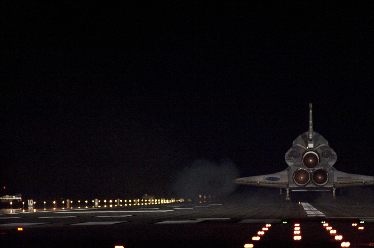 CAPE CANAVERAL, Fla. - Only the lights on Runway 15 illuminate space shuttle Endeavour as is touches down at the Shuttle Landing Facility at NASA's Kennedy Space Center in Florida. After 14 days in space, Endeavour's 5.7-million-mile STS-130 mission is completed on orbit 217.  Main gear touchdown was at 10:20:31 p.m. EST followed by nose gear touchdown at 10:20:39 p.m. and wheels stop at 10:22:10 p.m.  It was the 23rd night landing in shuttle history and the 17th at Kennedy.  Aboard are Commander George Zamka; Pilot Terry Virts; and Mission Specialists Robert Behnken, Nicholas Patrick, Kathryn Hire and Stephen Robinson.  During Endeavour's STS-130 mission, astronauts installed the Tranquility node, a module that provides additional room for crew members and many of the station's life support and environmental control systems. Attached to Tranquility is a cupola with seven windows that provide a panoramic view of Earth, celestial objects and visiting spacecraft. The module was built in Turin, Italy, by Thales Alenia Space for the European Space Agency.  The orbiting laboratory is approximately 90 percent complete now in terms of mass.  STS-130 was the 24th flight for Endeavour, the 32nd shuttle mission devoted to ISS assembly and maintenance, and the 130th shuttle mission to date.  For information on the STS-130 mission and crew, visit http:__www.nasa.gov_mission_pages_shuttle_shuttlemissions_sts130.  Photo credit: NASA_Sandra Joseph and Kevin O'Connell