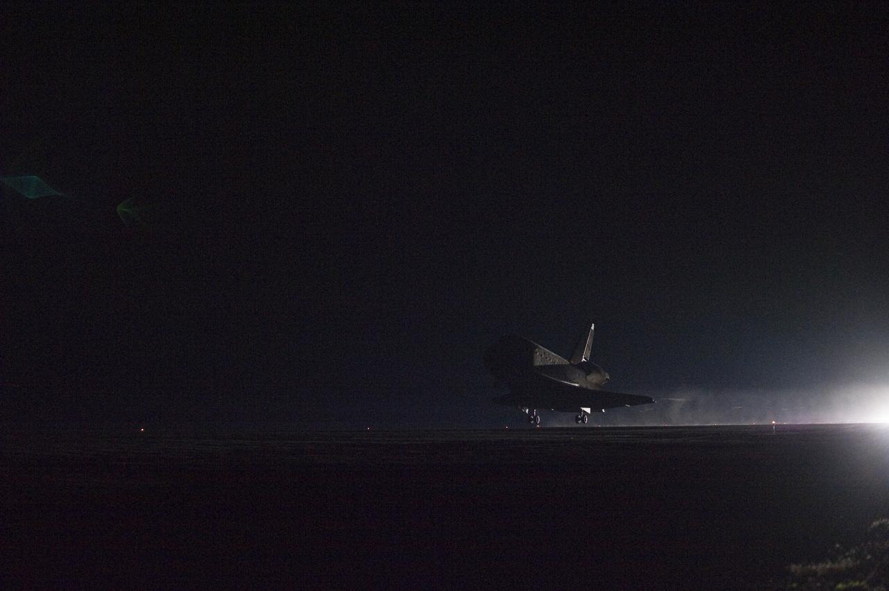 CAPE CANAVERAL, Fla. - Space shuttle Endeavour lands under the cover of night on Runway 15 at the Shuttle Landing Facility at NASA's Kennedy Space Center in Florida after 14 days in space, completing the 5.7-million-mile STS-130 mission to the International Space Station on orbit 217.  Main gear touchdown was at 10:20:31 p.m. EST followed by nose gear touchdown at 10:20:39 p.m. and wheels stop at 10:22:10 p.m.  It was the 23rd night landing in shuttle history and the 17th at Kennedy.  Aboard are Commander George Zamka; Pilot Terry Virts; and Mission Specialists Robert Behnken, Nicholas Patrick, Kathryn Hire and Stephen Robinson.  During Endeavour's STS-130 mission, astronauts installed the Tranquility node, a module that provides additional room for crew members and many of the station's life support and environmental control systems. Attached to Tranquility is a cupola with seven windows that provide a panoramic view of Earth, celestial objects and visiting spacecraft. The module was built in Turin, Italy, by Thales Alenia Space for the European Space Agency.  The orbiting laboratory is approximately 90 percent complete now in terms of mass.  STS-130 was the 24th flight for Endeavour, the 32nd shuttle mission devoted to ISS assembly and maintenance, and the 130th shuttle mission to date.  For information on the STS-130 mission and crew, visit http:__www.nasa.gov_mission_pages_shuttle_shuttlemissions_sts130.  Photo credit: NASA_Sandra Joseph and Kevin O'Connell