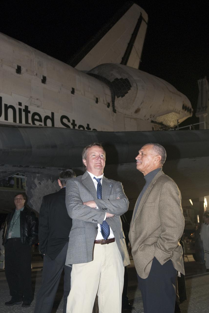 CAPE CANAVERAL, Fla. - NASA's Shuttle Launch Director Mike Leinbach, left, and NASA Administrator Charles Bolden wait to welcome the STS-130 crew back to Earth following space shuttle Endeavour's successful landing on Runway 15 at the Shuttle Landing Facility at NASA's Kennedy Space Center in Florida. After 14 days in space, Endeavour's 5.7-million-mile STS-130 mission was completed on orbit 217. Main gear touchdown was at 10:20:31 p.m. EST followed by nose gear touchdown at 10:20:39 p.m. and wheels stop at 10:22:10 p.m. It was the 23rd night landing in shuttle history and the 17th at Kennedy. During Endeavour's STS-130 mission, astronauts installed the Tranquility node, a module that provides additional room for crew members and many of the station's life support and environmental control systems. Attached to Tranquility is a cupola with seven windows that provide a panoramic view of Earth, celestial objects and visiting spacecraft. The module was built in Turin, Italy, by Thales Alenia Space for the European Space Agency. The orbiting laboratory is approximately 90 percent complete now in terms of mass. STS-130 was the 24th flight for Endeavour, the 32nd shuttle mission devoted to ISS assembly and maintenance, and the 130th shuttle mission to date. For information on the STS-130 mission and crew, visit http:__www.nasa.gov_mission_pages_shuttle_shuttlemissions_sts130_index.html. Photo credit: NASA_Kim Shiflett