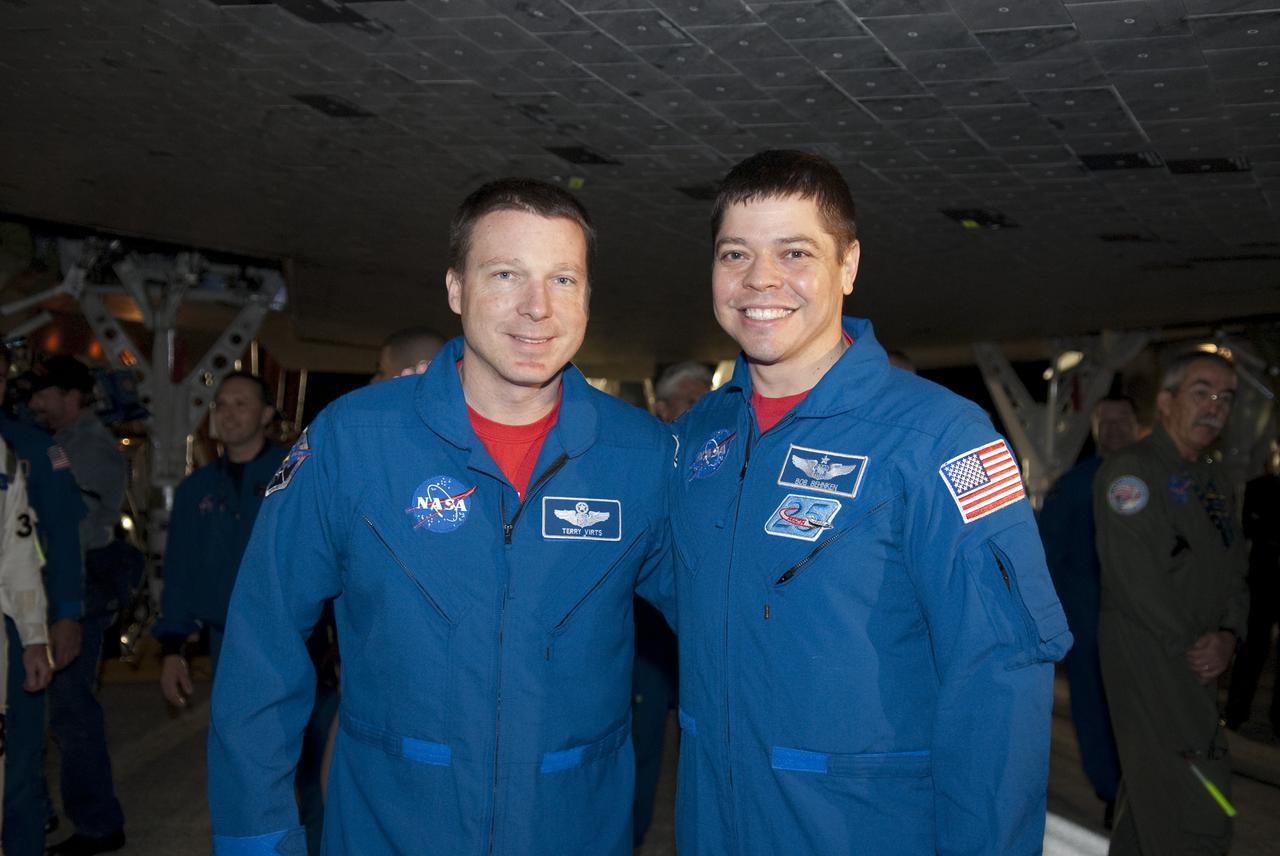 CAPE CANAVERAL, Fla. - STS-130 Pilot Terry Virts, left, and Mission Specialist Robert Behnken pause for a photograph under space shuttle Endeavour following its successful landing on Runway 15 at the Shuttle Landing Facility at NASA's Kennedy Space Center in Florida. After 14 days in space, Endeavour's 5.7-million-mile STS-130 mission was completed on orbit 217. Main gear touchdown was at 10:20:31 p.m. EST followed by nose gear touchdown at 10:20:39 p.m. and wheels stop at 10:22:10 p.m. It was the 23rd night landing in shuttle history and the 17th at Kennedy. During Endeavour's STS-130 mission, astronauts installed the Tranquility node, a module that provides additional room for crew members and many of the station's life support and environmental control systems. Attached to Tranquility is a cupola with seven windows that provide a panoramic view of Earth, celestial objects and visiting spacecraft. The module was built in Turin, Italy, by Thales Alenia Space for the European Space Agency. The orbiting laboratory is approximately 90 percent complete now in terms of mass. STS-130 was the 24th flight for Endeavour, the 32nd shuttle mission devoted to ISS assembly and maintenance, and the 130th shuttle mission to date. For information on the STS-130 mission and crew, visit http:__www.nasa.gov_mission_pages_shuttle_shuttlemissions_sts130_index.html. Photo credit: NASA_Kim Shiflett