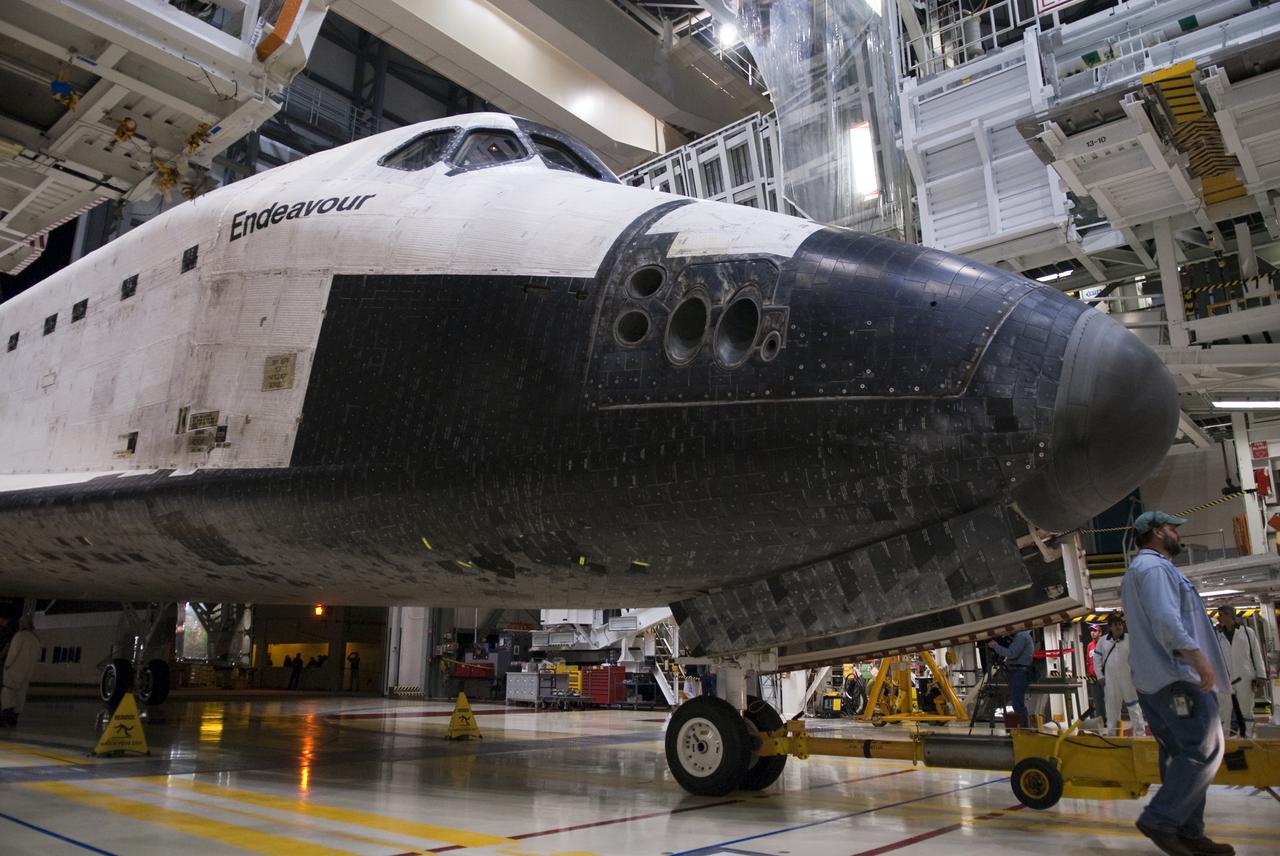 CAPE CANAVERAL, Fla. - At NASA's Kennedy Space Center in Florida, space shuttle Endeavour is towed into Orbiter Processing Facility-2.  Endeavour's touchdown at Kennedy's Shuttle Landing Facility following the STS-130 mission to the International Space Station was at 10:20 p.m. EST Feb. 21.  Processing now will begin for Endeavour's next flight, STS-134.  The six-member STS-134 crew will deliver Express Logistics Carrier 3 and the Alpha Magnetic Spectrometer to the International Space Station, as well as a variety of spare parts including two S-band communications antennas, a high-pressure gas tank, additional spare parts for Dextre and micrometeoroid debris shields. STS-134 will be the 35th shuttle mission to the station and the 133rd flight in the shuttle program.  Launch is targeted for July 29. For information on the STS-134 mission and crew, visit http:__www.nasa.gov_mission_pages_shuttle_shuttlemissions_sts134_index.html.  Photo credit: NASA_Kim Shiflett
