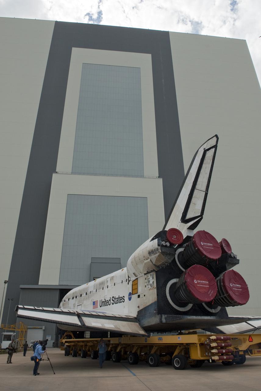 CAPE CANAVERAL, Fla. - At NASA's Kennedy Space Center in Florida, space shuttle Discovery is moved toward the Vehicle Assembly Building, or VAB, transfer aisle entrance. In the VAB, Discovery will be lifted into a high bay where it will be mated to its external tank and solid rocket boosters. The seven-member STS-131 crew will deliver the Multi-Purpose Logistics Module Leonardo, filled with resupply stowage platforms and racks, to the International Space Station aboard space shuttle Discovery.  Work to attach a spare ammonia tank assembly to the station's exterior and return a European experiment from outside the station's Columbus module will be conducted during three spacewalks.  STS-131, targeted for launch on April 5, will be the 33rd shuttle mission to the station and the 131st shuttle mission overall. For information on the STS-131 mission and crew, visit http:__www.nasa.gov_mission_pages_shuttle_shuttlemissions_sts131_index.html.  Photo credit: NASA_Jim Grossmann