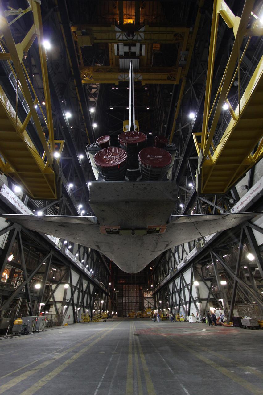 CAPE CANAVERAL, Fla. - In the Vehicle Assembly Building, or VAB, at NASA's Kennedy Space Center in Florida, the transporter has been moved from under space shuttle Discovery as preparations are made for its move into a high bay.  In the high bay, Discovery will be attached to its external fuel tank and solid rocket boosters completing the STS-131 shuttle stack. Rollout to Launch Pad 39A is planned for March 2.  The seven-member STS-131 crew will deliver the Multi-Purpose Logistics Module Leonardo, filled with resupply stowage platforms and racks, to the International Space Station aboard space shuttle Discovery.  Work to attach a spare ammonia tank assembly to the station's exterior and return a European experiment from outside the station's Columbus module will be conducted during three spacewalks.  STS-131, targeted for launch on April 5, will be the 33rd shuttle mission to the station and the 131st shuttle mission overall. For information on the STS-131 mission and crew, visit http:__www.nasa.gov_mission_pages_shuttle_shuttlemissions_sts131_index.html.  Photo credit: NASA_Troy Cryder