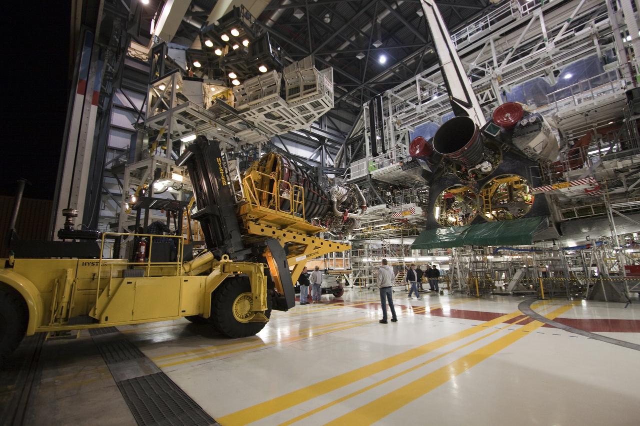 CAPE CANAVERAL, Fla. - At NASA's Kennedy Space Center in Florida, a Hyster forklift delivers a space shuttle main engine to Orbiter Processing Facility-1 where it will be installed on space shuttle Atlantis for its upcoming STS-132 mission. A main engine is 14 feet long, weighs approximately 7,000 pounds, and is 7.5 feet in diameter at the end of the nozzle. Inspection and maintenance of each of the shuttle's three main engines are an important safety measure and standard procedure between shuttle missions. Atlantis is scheduled to deliver an Integrated Cargo Carrier and Russian-built Mini Research Module to the International Space Station on STS-132. The second in a series of new pressurized components for Russia, the module will be permanently attached to the Zarya module. Three spacewalks are planned to store spare components outside the station, including six spare batteries, a boom assembly for the Ku-band antenna and spares for the Canadian Dextre robotic arm extension. A radiator, airlock and European robotic arm for the Russian Multi-purpose Laboratory Module also are payloads on the flight. Launch is targeted for May 14. Photo credit: NASA_Troy Cryder