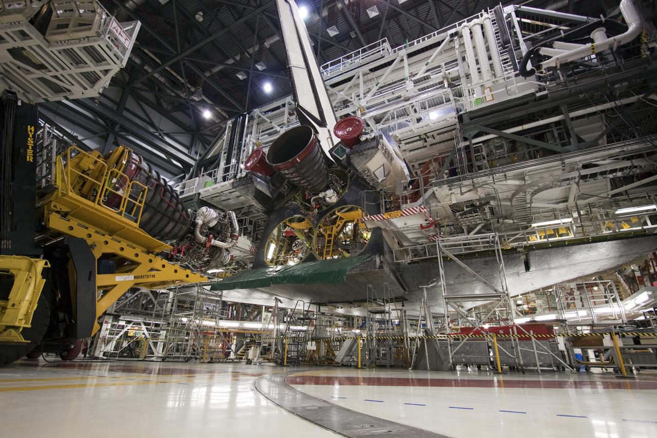 CAPE CANAVERAL, Fla. - In Orbiter Processing Facility-1 at NASA's Kennedy Space Center in Florida, preparations are under way to install space shuttle main engine #2 on space shuttle Atlantis for its upcoming STS-132 mission. A main engine is 14 feet long, weighs approximately 7,000 pounds, and is 7.5 feet in diameter at the end of the nozzle. Inspection and maintenance of each of the shuttle's three main engines are an important safety measure and standard procedure between shuttle missions. Atlantis is scheduled to deliver an Integrated Cargo Carrier and Russian-built Mini Research Module to the International Space Station on STS-132. The second in a series of new pressurized components for Russia, the module will be permanently attached to the Zarya module. Three spacewalks are planned to store spare components outside the station, including six spare batteries, a boom assembly for the Ku-band antenna and spares for the Canadian Dextre robotic arm extension. A radiator, airlock and European robotic arm for the Russian Multi-purpose Laboratory Module also are payloads on the flight. Launch is targeted for May 14. Photo credit: NASA_Troy Cryder