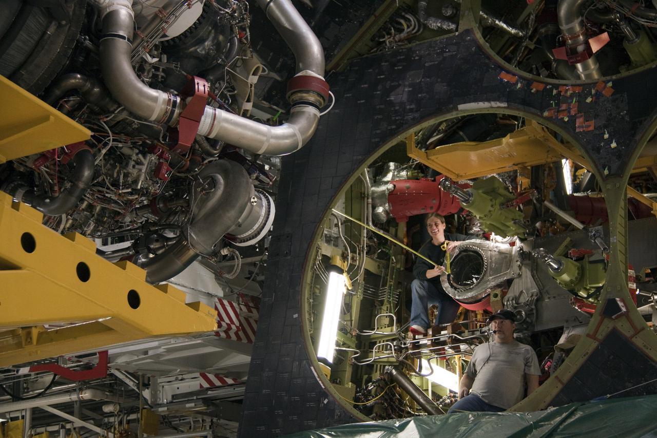 CAPE CANAVERAL, Fla. - In Orbiter Processing Facility-1 at NASA's Kennedy Space Center in Florida, workers guide a space shuttle main engine into position for installation on space shuttle Atlantis for its upcoming STS-132 mission. A main engine is 14 feet long, weighs approximately 7,000 pounds, and is 7.5 feet in diameter at the end of the nozzle. Inspection and maintenance of each of the shuttle's three main engines are an important safety measure and standard procedure between shuttle missions. Atlantis is scheduled to deliver an Integrated Cargo Carrier and Russian-built Mini Research Module to the International Space Station on STS-132. The second in a series of new pressurized components for Russia, the module will be permanently attached to the Zarya module. Three spacewalks are planned to store spare components outside the station, including six spare batteries, a boom assembly for the Ku-band antenna and spares for the Canadian Dextre robotic arm extension. A radiator, airlock and European robotic arm for the Russian Multi-purpose Laboratory Module also are payloads on the flight. Launch is targeted for May 14. Photo credit: NASA_Troy Cryder