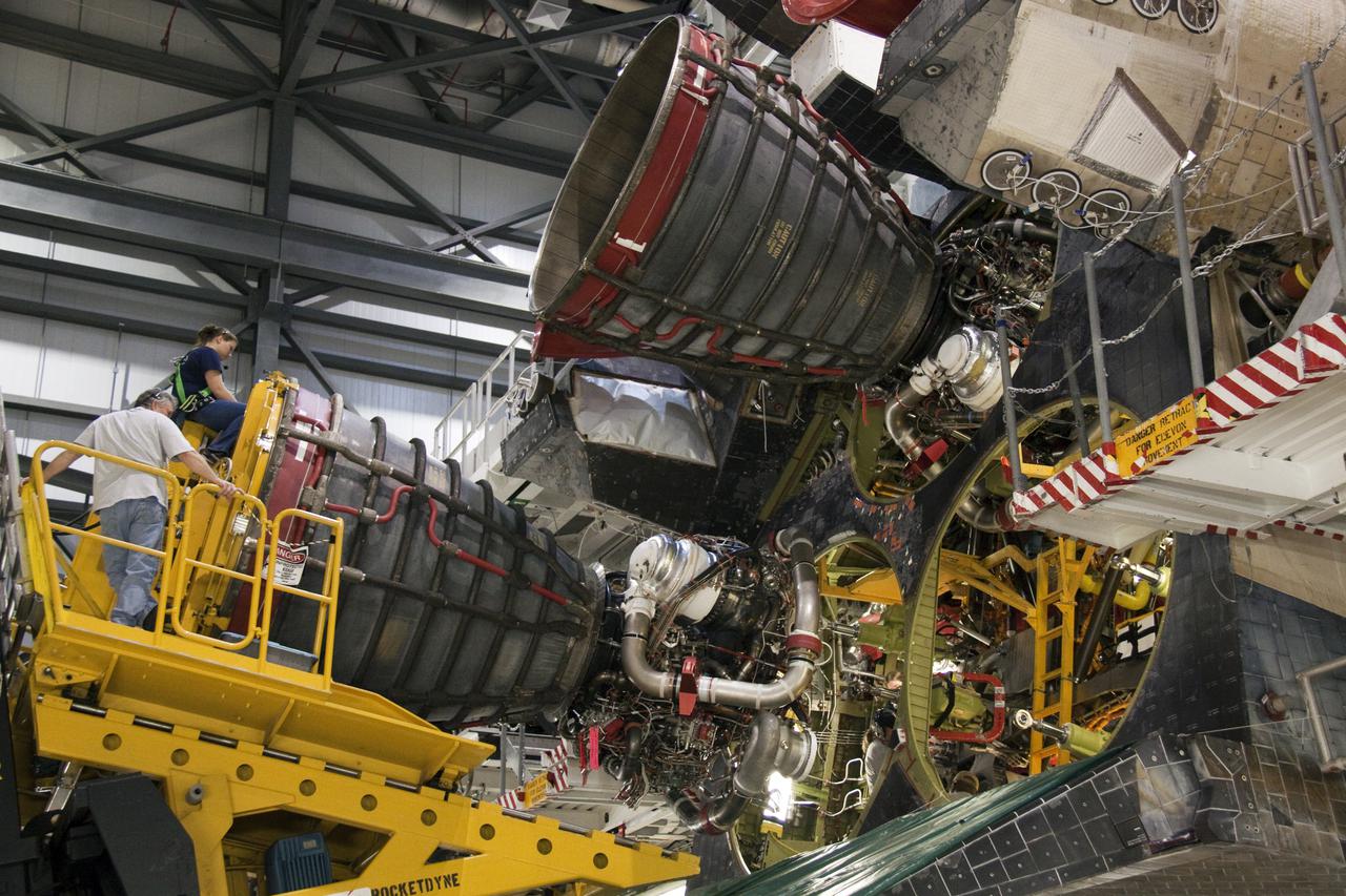 CAPE CANAVERAL, Fla. - In Orbiter Processing Facility-1 at NASA's Kennedy Space Center in Florida, space shuttle main engine #2 is nearly in position for installation on space shuttle Atlantis for its upcoming STS-132 mission. A main engine is 14 feet long, weighs approximately 7,000 pounds, and is 7.5 feet in diameter at the end of the nozzle. Inspection and maintenance of each of the shuttle's three main engines are an important safety measure and standard procedure between shuttle missions. Atlantis is scheduled to deliver an Integrated Cargo Carrier and Russian-built Mini Research Module to the International Space Station on STS-132. The second in a series of new pressurized components for Russia, the module will be permanently attached to the Zarya module. Three spacewalks are planned to store spare components outside the station, including six spare batteries, a boom assembly for the Ku-band antenna and spares for the Canadian Dextre robotic arm extension. A radiator, airlock and European robotic arm for the Russian Multi-purpose Laboratory Module also are payloads on the flight. Launch is targeted for May 14. Photo credit: NASA_Troy Cryder