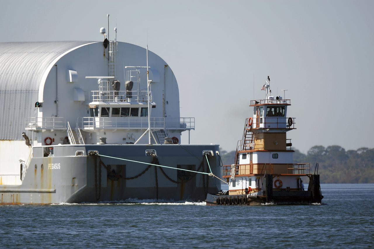 CAPE CANAVERAL, Fla. – The Pegasus barge carrying External Tank-136 arrives near the turn basin at Kennedy Space Center in Florida, from NASA’s Michoud Assembly Facility near New Orleans. ET-136 will be used to launch space shuttle Atlantis on the STS-132 mission to the International Space Station. Launch is targeted for May 14. For more information on the components of the space shuttle and the STS-132 mission, visit http:__www.nasa.gov_mission_pages_shuttle_shuttlemissions_sts132_index.html. Photo credit: NASA_Rusty Backer.