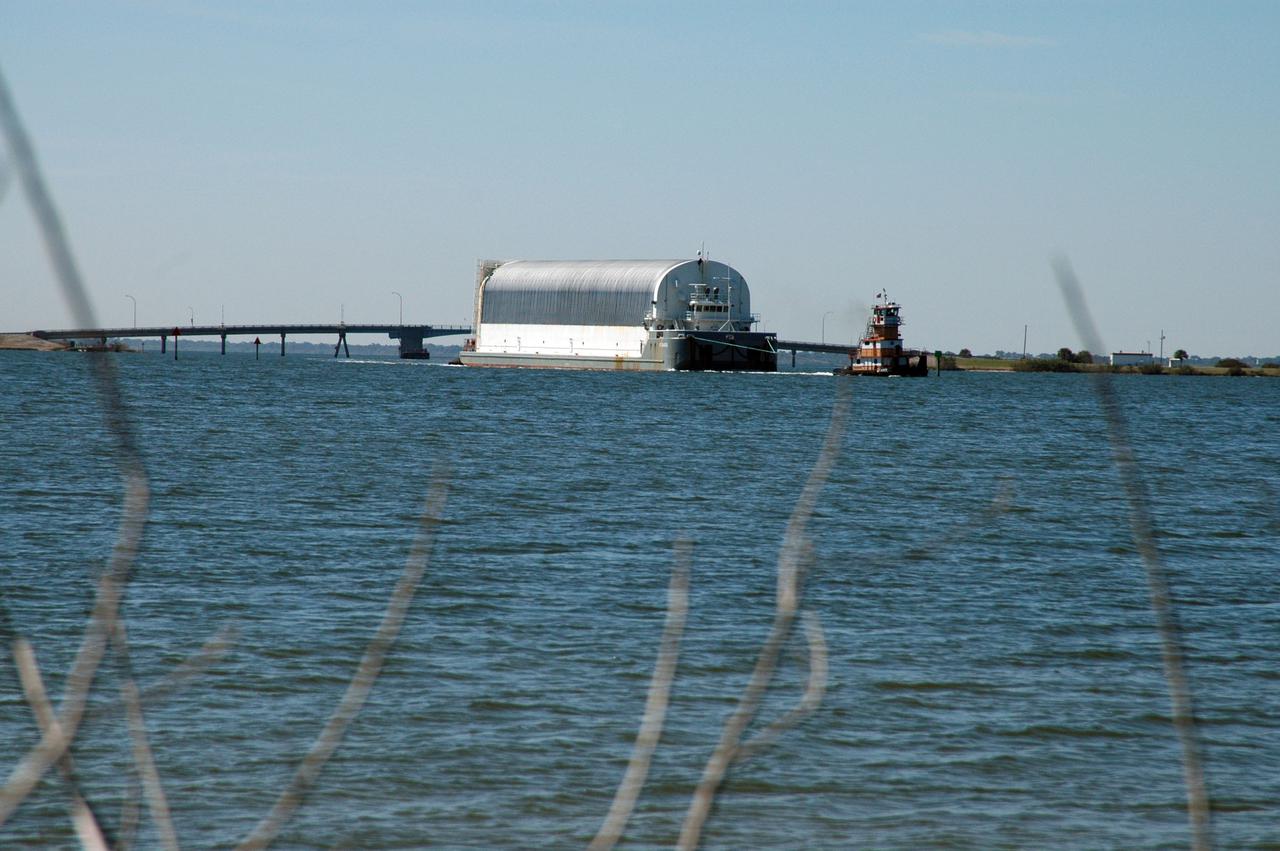 CAPE CANAVERAL, Fla. – A tugboat pulls the Pegasus barge carrying External Tank-136 through Port Canaveral on its way from NASA’s Michoud Assembly Facility near New Orleans to the turn basin at NASA's Kennedy Space Center in Florida. ET-136 will be used to launch space shuttle Atlantis on the STS-132 mission to the International Space Station. Launch is targeted for May 14. For more information on the components of the space shuttle and the STS-132 mission, visit http:__www.nasa.gov_mission_pages_shuttle_shuttlemissions_sts132_index.html. Photo credit: NASA_Cory Huston
