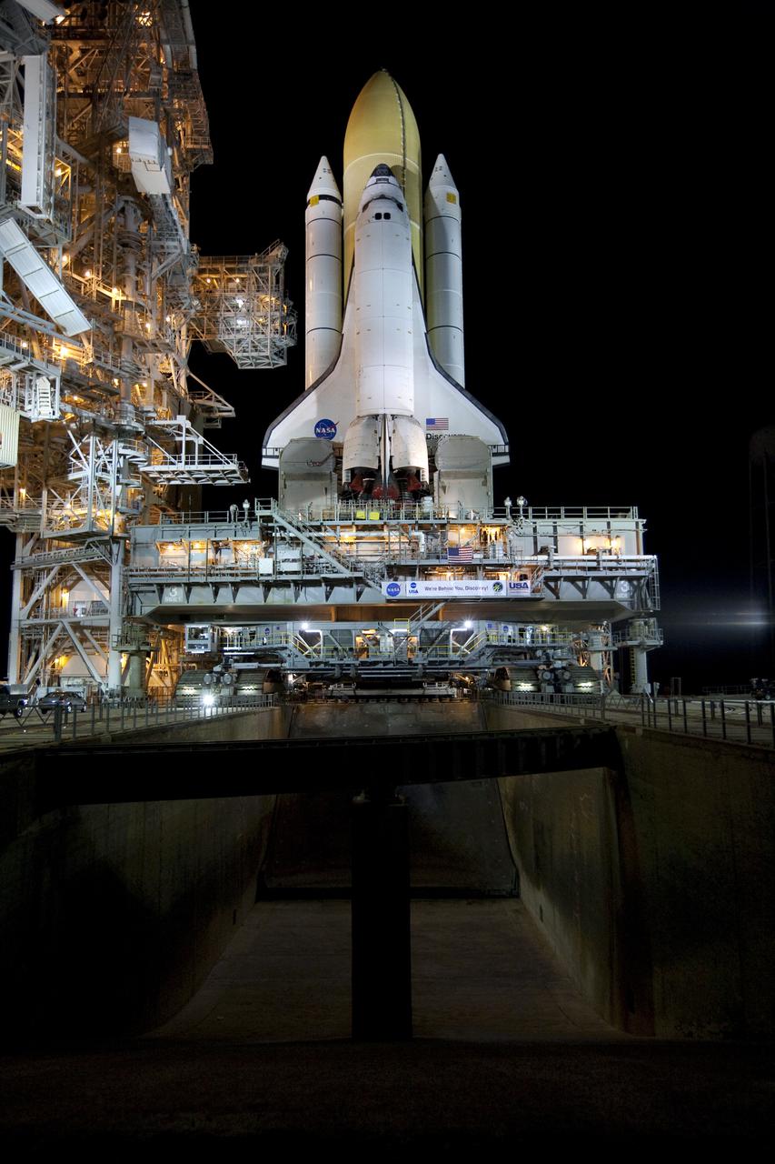 CAPE CANAVERAL, Fla. – On Launch Pad 39A at NASA's Kennedy Space Center in Florida, operations are under way to secure the mobile launcher platform supporting space shuttle Discovery on the pad's pedestals. Discovery's first motion on its 3.4-mile trip from the Vehicle Assembly Building was at 11:58 p.m. EST March 2. The shuttle was secured on the pad at 6:48 a.m. March 3. Rollout is a significant milestone in launch processing activities. The seven-member STS-131 crew will deliver the multi-purpose logistics module Leonardo, filled with resupply stowage platforms and racks, to the International Space Station aboard Discovery. Targeted for launch on April 5, STS-131 will be the 33rd shuttle mission to the station and the 131st shuttle mission overall. For information on the STS-131 mission and crew, visit http:__www.nasa.gov_mission_pages_shuttle_shuttlemissions_sts131_index.html. Photo credit: NASA_Amanda Diller