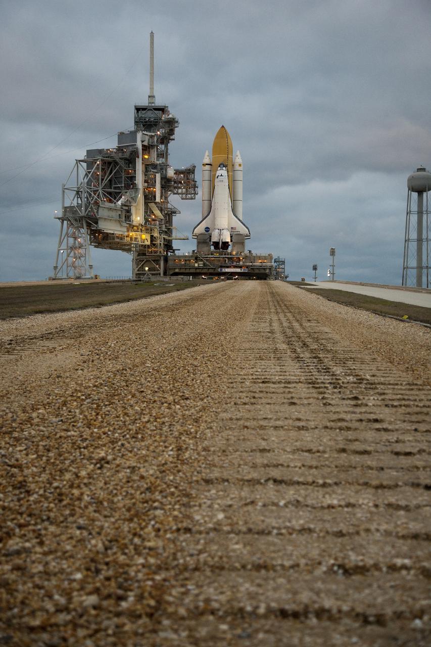 CAPE CANAVERAL, Fla. – Sunrise finds space shuttle Discovery has traveled the five percent grade to the top of Launch Pad 39A at NASA's Kennedy Space Center in Florida. Discovery's first motion on its 3.4-mile trip from the Vehicle Assembly Building was at 11:58 p.m. EST March 2. The shuttle was secured on the pad at 6:48 a.m. March 3. Rollout is a significant milestone in launch processing activities. The seven-member STS-131 crew will deliver the multi-purpose logistics module Leonardo, filled with resupply stowage platforms and racks, to the International Space Station aboard Discovery. Targeted for launch on April 5, STS-131 will be the 33rd shuttle mission to the station and the 131st shuttle mission overall. For information on the STS-131 mission and crew, visit http:__www.nasa.gov_mission_pages_shuttle_shuttlemissions_sts131_index.html. Photo credit: NASA_Amanda Diller
