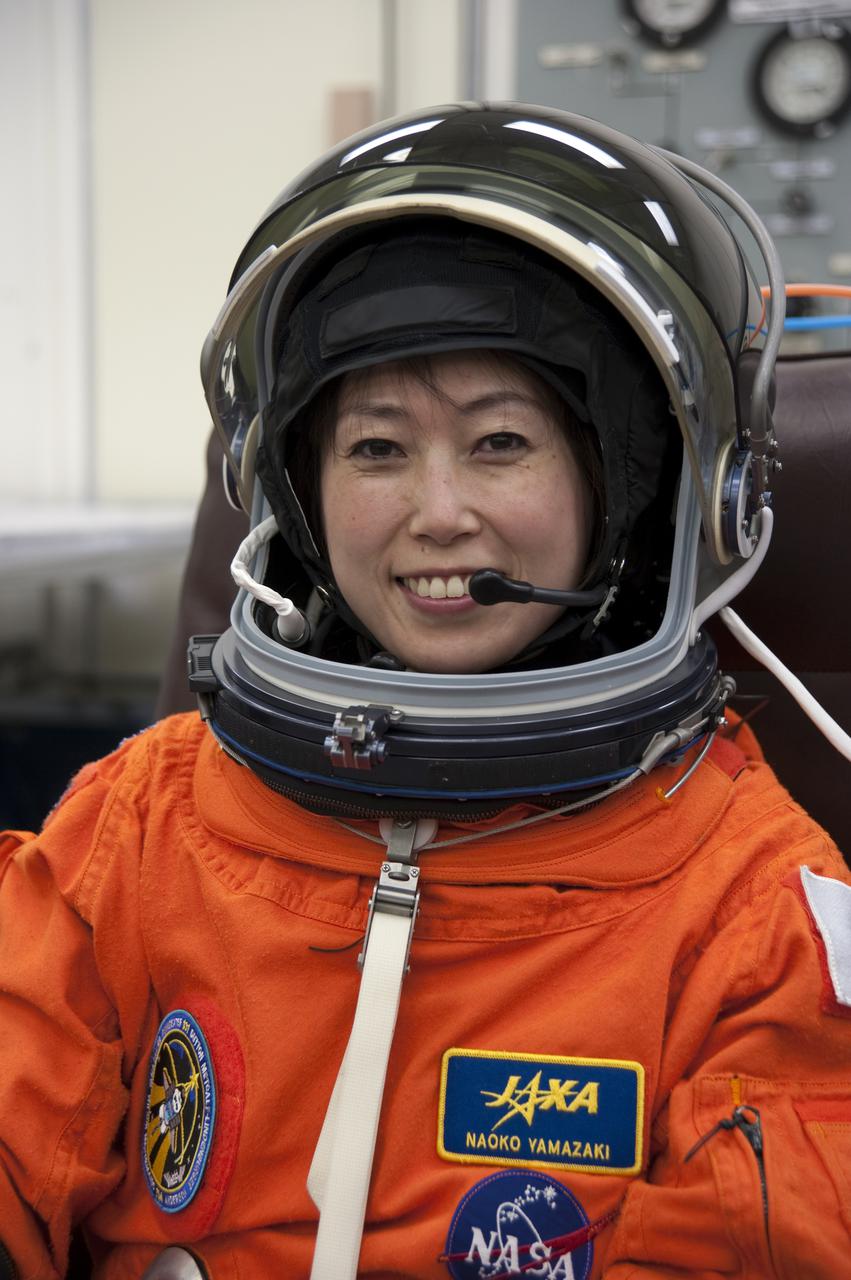 CAPE CANAVERAL, Fla. - In the Operations and Checkout Building at NASA's Kennedy Space Center in Florida, STS-131 Mission Specialist Naoko Yamazaki of the Japan Aerospace Exploration Agency verifies that her helmet is functioning properly. The members of space shuttle Discovery's STS-131 crew put on their launch-and-entry suits before heading to the Astrovan for the ride to Launch Pad 39A. The crew is participating in the Terminal Countdown Demonstration Test, or TCDT, a dress rehearsal for launch. TCDT includes training on the emergency egress systems at the launch pad, driving practice of the M-113 armored personnel carrier and a simulated launch countdown. The crew will deliver the multi-purpose logistics module Leonard, filled with resupply stowage platforms and science racks, to the International Space Station. STS-131, targeted for launch on April 5, will be the 33rd shuttle mission to the station and the 131st shuttle mission overall. For information on the STS-131 mission and crew, visit http:__www.nasa.gov_mission_pages_shuttle_shuttlemissions_sts131_index.htm. Photo credit: NASA_Kim Shiflett