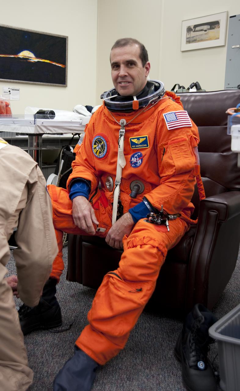 CAPE CANAVERAL, Fla. - In the Operations and Checkout Building at NASA's Kennedy Space Center in Florida, STS-131 Mission Specialist Rick Mastracchio suits up for his third practice countdown. The members of space shuttle Discovery's STS-131 crew put on their launch-and-entry suits before heading to the Astrovan for the ride to Launch Pad 39A. The crew is participating in the Terminal Countdown Demonstration Test, or TCDT, a dress rehearsal for launch. TCDT includes training on the emergency egress systems at the launch pad, driving practice of the M-113 armored personnel carrier and a simulated launch countdown. The crew will deliver the multi-purpose logistics module Leonard, filled with resupply stowage platforms and science racks, to the International Space Station. STS-131, targeted for launch on April 5, will be the 33rd shuttle mission to the station and the 131st shuttle mission overall. For information on the STS-131 mission and crew, visit http:__www.nasa.gov_mission_pages_shuttle_shuttlemissions_sts131_index.htm. Photo credit: NASA_Kim Shiflett