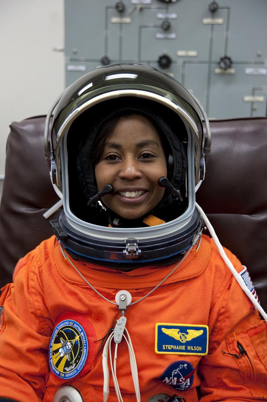 CAPE CANAVERAL, Fla. - In the Operations and Checkout Building at NASA's Kennedy Space Center in Florida, STS-131 Mission Specialist Stephanie Wilson verifies that her helmet is functioning properly. The members of space shuttle Discovery's STS-131 crew put on their launch-and-entry suits before heading to the Astrovan for the ride to Launch Pad 39A. The crew is participating in the Terminal Countdown Demonstration Test, or TCDT, a dress rehearsal for launch. TCDT includes training on the emergency egress systems at the launch pad, driving practice of the M-113 armored personnel carrier and a simulated launch countdown. The crew will deliver the multi-purpose logistics module Leonard, filled with resupply stowage platforms and science racks, to the International Space Station. STS-131, targeted for launch on April 5, will be the 33rd shuttle mission to the station and the 131st shuttle mission overall. For information on the STS-131 mission and crew, visit http:__www.nasa.gov_mission_pages_shuttle_shuttlemissions_sts131_index.htm. Photo credit: NASA_Kim Shiflett
