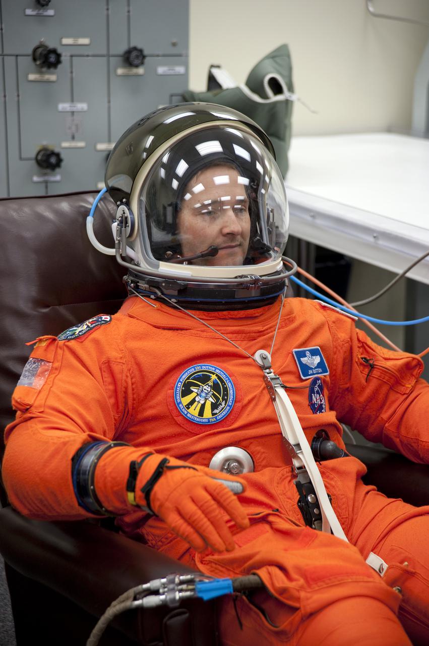 CAPE CANAVERAL, Fla. - In the Operations and Checkout Building at NASA's Kennedy Space Center in Florida, STS-131 Pilot James P. Dutton Jr. verifies that his helmet is functioning properly. The members of space shuttle Discovery's STS-131 crew put on their launch-and-entry suits before heading to the Astrovan for the ride to Launch Pad 39A. The crew is participating in the Terminal Countdown Demonstration Test, or TCDT, a dress rehearsal for launch. TCDT includes training on the emergency egress systems at the launch pad, driving practice of the M-113 armored personnel carrier and a simulated launch countdown. The crew will deliver the multi-purpose logistics module Leonard, filled with resupply stowage platforms and science racks, to the International Space Station. STS-131, targeted for launch on April 5, will be the 33rd shuttle mission to the station and the 131st shuttle mission overall. For information on the STS-131 mission and crew, visit http:__www.nasa.gov_mission_pages_shuttle_shuttlemissions_sts131_index.htm. Photo credit: NASA_Kim Shiflett