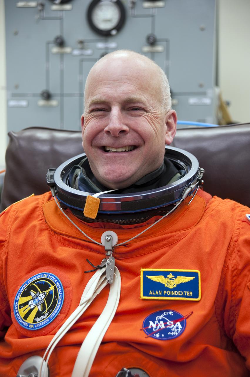 CAPE CANAVERAL, Fla. - In the Operations and Checkout Building at NASA's Kennedy Space Center in Florida, STS-131 Commander Alan Poindexter appears enthusiastic about the opportunity to board Discovery. The members of space shuttle Discovery's STS-131 crew put on their launch-and-entry suits before heading to the Astrovan for the ride to Launch Pad 39A. The crew is participating in the Terminal Countdown Demonstration Test, or TCDT, a dress rehearsal for launch. TCDT includes training on the emergency egress systems at the launch pad, driving practice of the M-113 armored personnel carrier and a simulated launch countdown. The crew will deliver the multi-purpose logistics module Leonard, filled with resupply stowage platforms and science racks, to the International Space Station. STS-131, targeted for launch on April 5, will be the 33rd shuttle mission to the station and the 131st shuttle mission overall. For information on the STS-131 mission and crew, visit http:__www.nasa.gov_mission_pages_shuttle_shuttlemissions_sts131_index.htm. Photo credit: NASA_Kim Shiflett