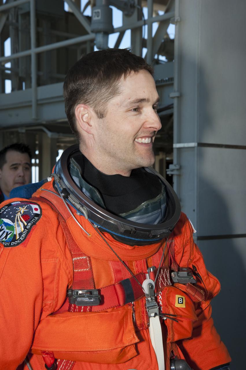CAPE CANAVERAL, Fla. - At Launch Pad 39A at NASA's Kennedy Space Center in Florida, STS-131 Pilot James P. Dutton Jr. appears pleased with the day's training.  The crew members of space shuttle Discovery's STS-131 mission are participating in training related to their launch dress rehearsal, the Terminal Countdown Demonstration Test.  The seven-member crew will deliver the multi-purpose logistics module Leonardo, filled with resupply stowage platforms and racks, to the International Space Station aboard Discovery. Targeted for launch on April 5, STS-131 will be the 33rd shuttle mission to the station and the 131st shuttle mission overall. For information on the STS-131 mission and crew, visit http:__www.nasa.gov_mission_pages_shuttle_shuttlemissions_sts131_index.html. Photo credit: NASA_Kim Shiflett
