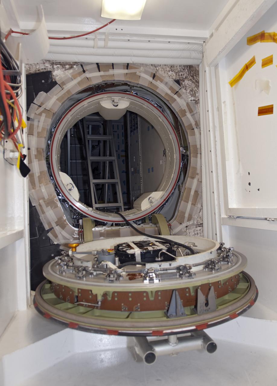 CAPE CANAVERAL, Fla. - Inside Orbiter Processing Facility-1 at Kennedy Space Center in Florida, shuttle Atlantis’ hatch closure is in the open position in preparation for the Mylar Pull Test. During the test, the hatch is closed and a scale is used to measure the force required to pull a piece of Mylar paper out from between the door and structural wall thermal barriers. The pull test is performed to ensure the integrity of the hatch and that it has closed properly. Atlantis is being processed for the STS-132 mission targeted for launch May 14. The six-member crew will deliver an Integrated Cargo Carrier and a Russian-built Mini Research Module to the International Space Station. Photo credit: NASA_Jim Grossmann