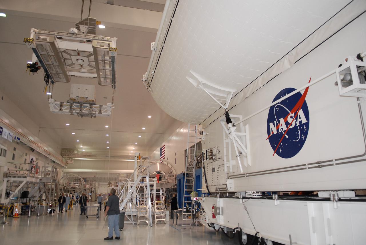 CAPE CANAVERAL, Fla. - Inside the Space Station Processing Facility at Kennedy Space Center in Florida, the Lightweight Multi-Purpose Equipment Support Structure Carrier carrying the Ammonia Tank Assembly, is lifted by crane for installation into the payload canister. The carrier is part of the STS-131 mission payload for delivery to the International Space Station aboard space shuttle Discovery. The STS-131 mission will also deliver the multi-purpose logistics module Leonardo, filled with resupply stowage platforms and science racks to the station. STS-131, targeted for launch on April 5, will be the 33rd shuttle mission to the station and the 131st shuttle mission overall. For more information on the mission and crew, visit http:__www.nasa.gov_mission_pages_shuttle_shuttlemissions_sts131_index.htm. Photo credit: NASA_Glen Benson