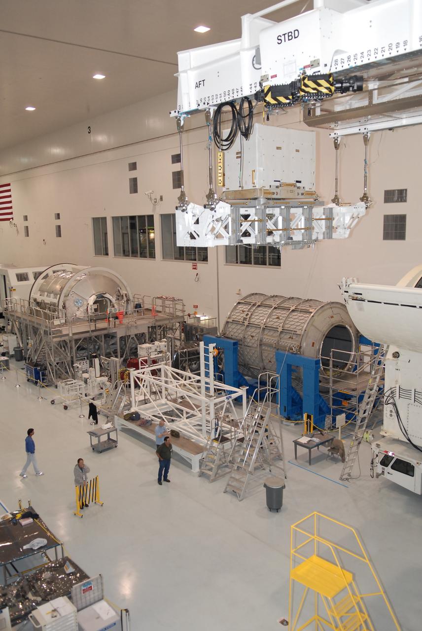 STS-131 LMC Support Structure Carrier Lift & Installation in Canister