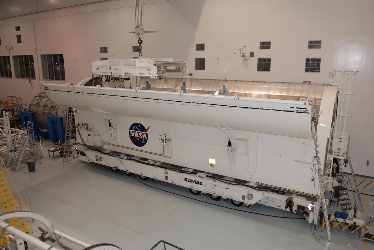 STS-131 LMC Support Structure Carrier Lift & Installation in Canister