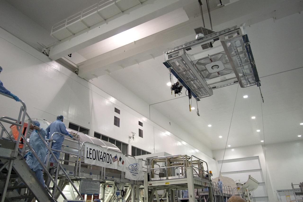 CAPE CANAVERAL, Fla. - In the Space Station Processing Facility at NASA's Kennedy Space Center in Florida, workers move the scales toward the multi-purpose logistics module Leonardo to determine its weight and center of gravity.  Leonardo will be transported to Launch Pad 39A and installed into space shuttle Discovery for its upcoming flight.  The seven-member STS-131 crew will deliver Leonardo, filled with resupply stowage platforms and racks, to the International Space Station.  STS-131 will be the 33rd shuttle mission to the station and the 131st shuttle mission overall. Launch is targeted for April 5.  For information on the STS-131 mission and crew, visit http:__www.nasa.gov_mission_pages_shuttle_shuttlemissions_sts131_index.html.  Photo credit: NASA_Jack Pfaller