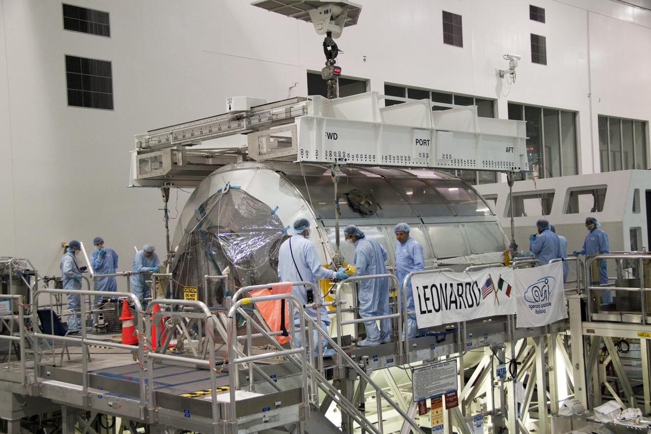 STS-131 MPLM LEONARDO MOVE FROM WORKSTAND TO WEIGHT & CG THEN MOVE TO CANISTER