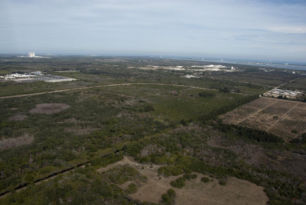 CAPE CANAVERAL, Fla. - Land located south of NASA's Kennedy Space Center Visitor Complex in Florida and adjacent to the Space Life Sciences Laboratory is the proposed site for Exploration Park.  Kennedy and Space Florida, an independent special district of the State of Florida, have partnered to enable the development of a mixed-use technology and commerce park. Exploration Park will become home to diverse private sector technology and innovation enterprises offering opportunities to grow and deploy commercial space capabilities and will respond to national priorities in science and technology. The park is expected to attract tenants engaged in space technology, space commerce and space education. In addition, NASA and Space Florida plan to incorporate the existing 100,000 square foot Space Life Sciences Laboratory into the park, broadening the lab's accessibility and use beyond NASA. For more information, visit www.explorationpark.com. Photo credit: NASA_Kim Shiflett