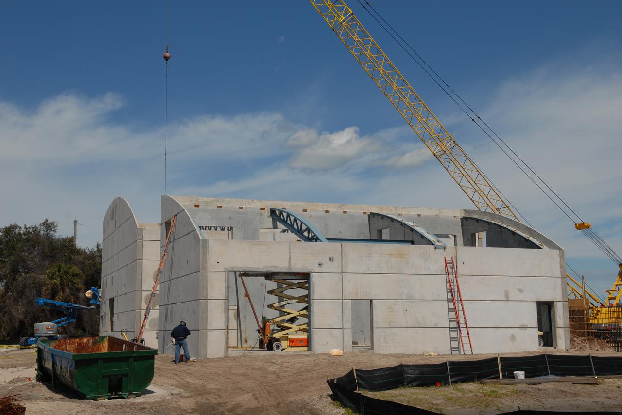CAPE CANAVERAL, Fla. - In Launch Complex 39 at NASA's Kennedy Space Center in Florida, preparations are under way to install the roofs on the Propellants North Administrative and Maintenance Facility buildings.  The facility will have a two-story administrative building to house managers, mechanics and technicians who fuel spacecraft at Kennedy adjacent to an 1,800-square-foot single-story shop to store cryogenic fuel transfer equipment.  The new facility will feature high-efficiency roofs and walls, “Cool Dry Quiet” air conditioning with energy recovery technology, efficient lighting, and other sustainable features. The facility is striving to qualify for the U.S. Green Building Council’s Leadership in Energy and Environmental Design, or LEED, Platinum certification. If successful, Propellants North will be the first Kennedy facility to achieve this highest of LEED ratings after it is completed in December 2010.  The facility was designed for NASA by Jones Edmunds and Associates.  H. W. Davis Construction is the construction contractor. Photo credit: NASA_Jim Grossmann