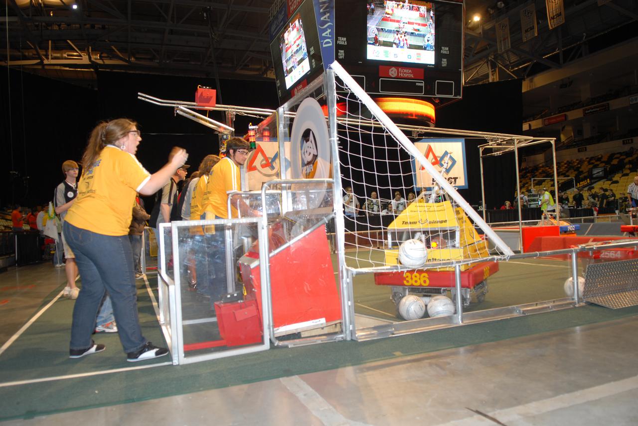 CAPE CANAVERAL, Fla. – Team Voltage participates in the regional FIRST robotics competition at the University of Central Florida in Orlando, Fla.  The team is made up of students from Melbourne High School in Florida.  More than 50 high school teams took part in the competition called 'For Inspiration and Recognition of Science and Technology,' or FIRST, in hopes of advancing to the national robotics championship.  FIRST, founded in 1989, is a non-profit organization that designs accessible, innovative programs to build self-confidence, knowledge and life skills while motivating young people to pursue academic opportunities. The robotics competition challenges teams of high school students and their mentors to solve a common problem in a six-week timeframe using a standard kit of parts and a common set of rules.  NASA is the largest sponsor of the international program. Kennedy Space Center is a sponsor of the regional event. Photo credit: NASA_Jim Grossmann