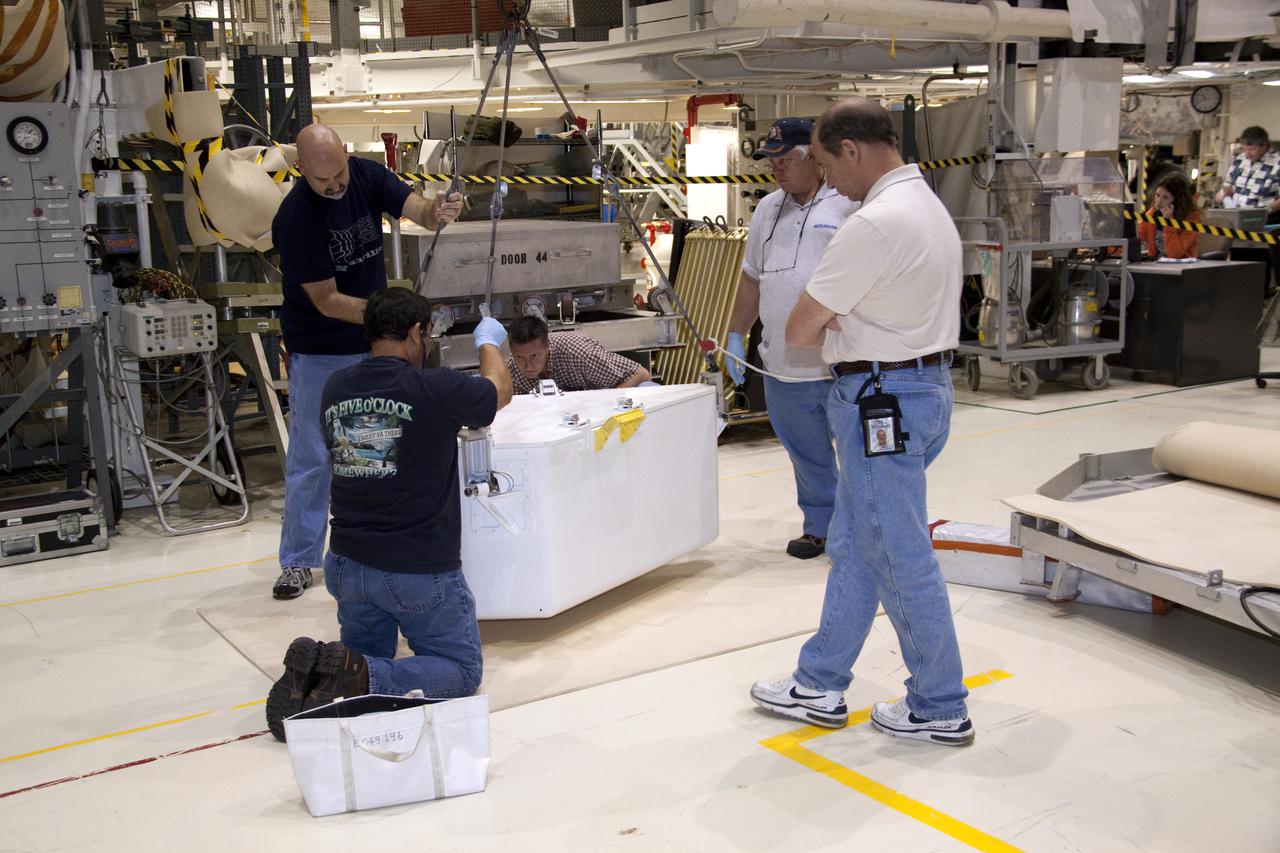 CAPE CANAVERAL, Fla. – In Orbiter Processing Facility-1 at NASA's Kennedy Space Center in Florida, workers attach the tool stowage assembly to a jib crane that will lift it into space shuttle Atlantis' payload bay. The assembly contains tools and hardware that will be needed on the extravehicular activities, or spacewalks, conducted during the STS-132 mission. On STS-132, the six-member crew will deliver an Integrated Cargo Carrier and a Russian-built Mini-Research Module to the International Space Station. STS-132 is the 34th mission to the station and the 132nd space shuttle mission. Launch is targeted for May 14. For information on the STS-132 mission, visit http:__www.nasa.gov_mission_pages_shuttle_shuttlemissions_sts132_index.html. Photo credit: NASA_Jack Pfaller