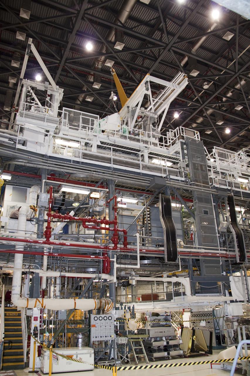 CAPE CANAVERAL, Fla. – In Orbiter Processing Facility-1 at NASA's Kennedy Space Center in Florida, the tool stowage assembly is lifted by jib crane over a work platform.  The tool box will be moved across the platform and installed into space shuttle Atlantis' payload bay.  The assembly contains tools and hardware that will be needed on the extravehicular activities, or spacewalks, conducted during the STS-132 mission. On STS-132, the six-member crew will deliver an Integrated Cargo Carrier and a Russian-built Mini-Research Module to the International Space Station.  STS-132 is the 34th mission to the station and the 132nd space shuttle mission.   Launch is targeted for May 14.  For information on the STS-132 mission, visit http:__www.nasa.gov_mission_pages_shuttle_shuttlemissions_sts132_index.html. Photo credit: NASA_Jack Pfaller