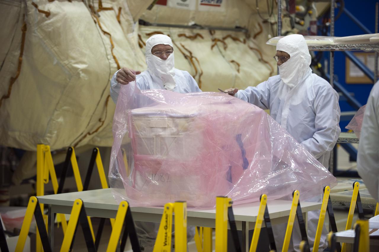 CAPE CANAVERAL, Fla. – In the Astrotech payload processing facility at Port Canaveral, Fla., supplies and other cargo are prepared for installation in the Russian-built Mini-Research Module, or MRM, in the background.  The six-member crew of space shuttle Atlantis' STS-132 mission will deliver an Integrated Cargo Carrier and the MRM to the International Space Station.  The second in a series of new pressurized components for Russia, the MRM will be permanently attached to the bottom port of the Zarya module. The MRM also will carry U.S. pressurized cargo.  STS-132 is the 34th mission to the station and the 132nd space shuttle mission.   Launch is targeted for May 14.  For information on the STS-132 mission, visit http:__www.nasa.gov_mission_pages_shuttle_shuttlemissions_sts132_index.html. Photo credit: NASA_Kim Shiflett