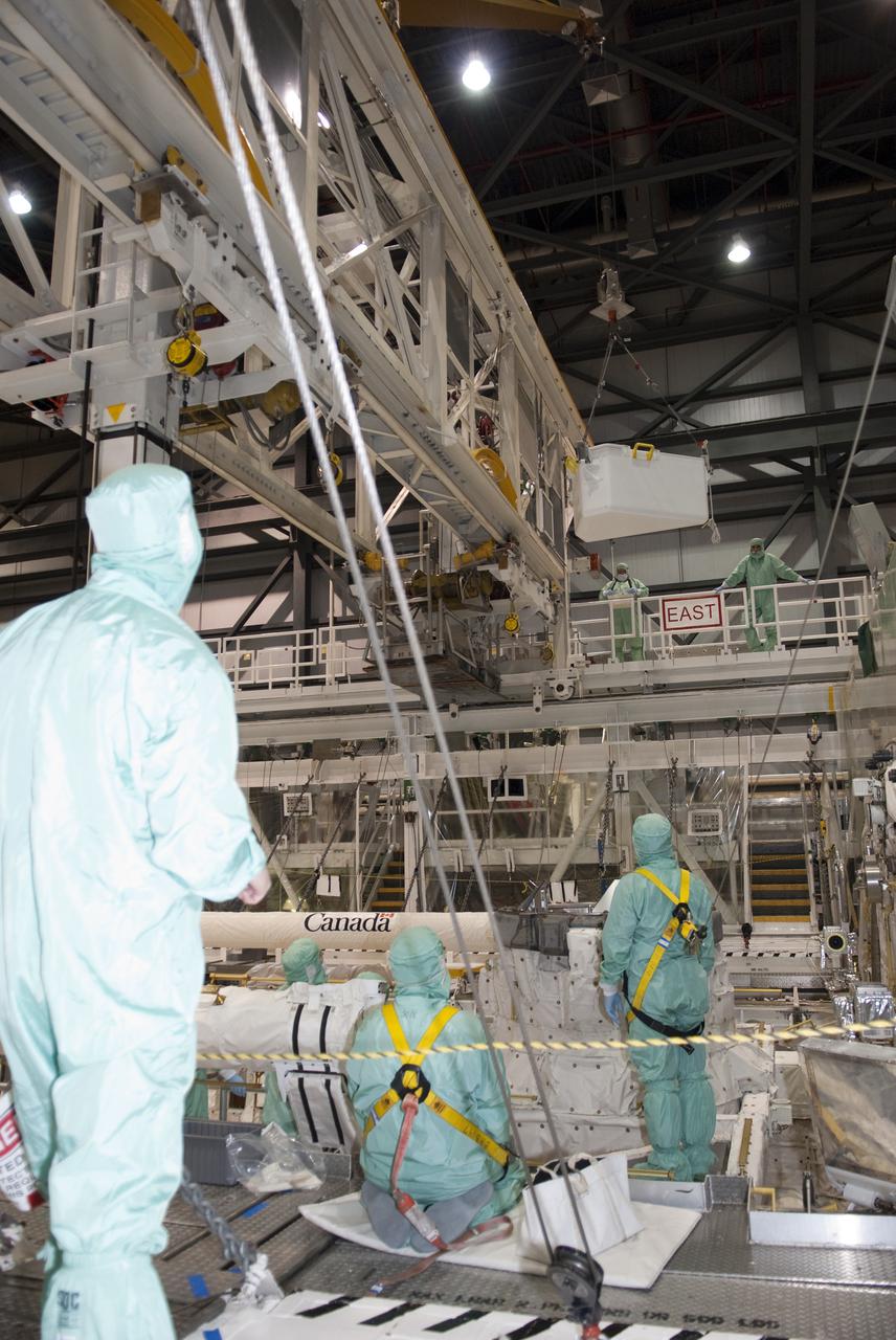 CAPE CANAVERAL, Fla. – In Orbiter Processing Facility-1 at NASA's Kennedy Space Center in Florida, a jib crane lowers the tool stowage assembly into space shuttle Atlantis' payload bay where it will be installed. The assembly contains tools and hardware that will be needed on the extravehicular activities, or spacewalks, conducted during the STS-132 mission. On STS-132, the six-member crew will deliver an Integrated Cargo Carrier and a Russian-built Mini-Research Module to the International Space Station. STS-132 is the 34th mission to the station and the 132nd space shuttle mission. Launch is targeted for May 14. For information on the STS-132 mission, visit http:__www.nasa.gov_mission_pages_shuttle_shuttlemissions_sts132_index.html. Photo credit: NASA_Jim Grossmann