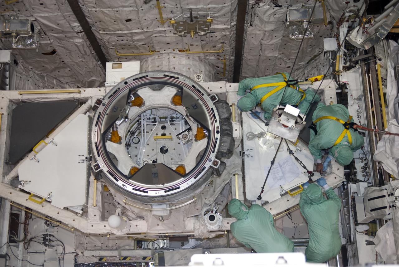 CAPE CANAVERAL, Fla. – In Orbiter Processing Facility-1 at NASA's Kennedy Space Center in Florida, workers dressed in clean room attire, known as bunny suits, install the tool stowage assembly in space shuttle Atlantis' payload bay. The assembly contains tools and hardware that will be needed on the extravehicular activities, or spacewalks, conducted during the STS-132 mission. On STS-132, the six-member crew will deliver an Integrated Cargo Carrier and a Russian-built Mini-Research Module to the International Space Station. STS-132 is the 34th mission to the station and the 132nd space shuttle mission. Launch is targeted for May 14. For information on the STS-132 mission, visit http:__www.nasa.gov_mission_pages_shuttle_shuttlemissions_sts132_index.html. Photo credit: NASA_Jim Grossmann