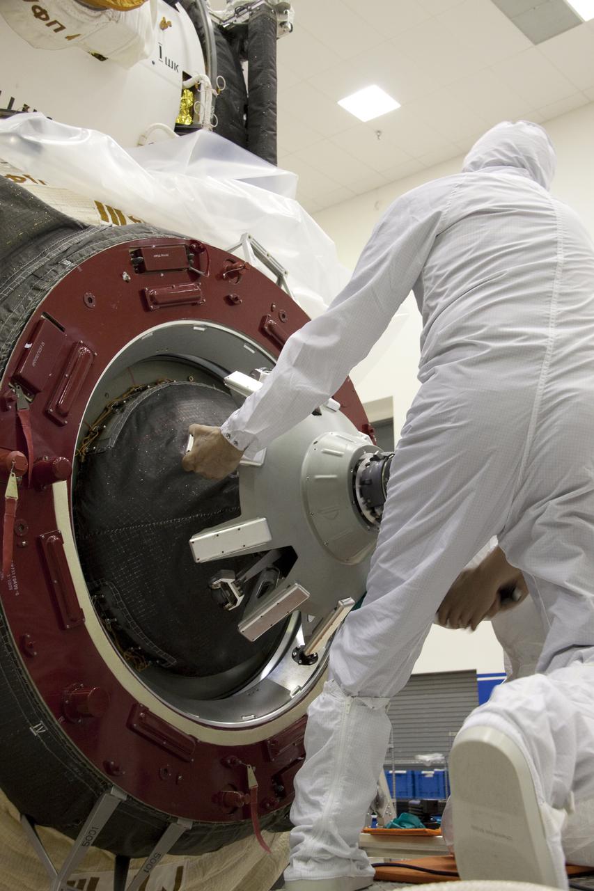 CAPE CANAVERAL, Fla. – In the Astrotech payload processing facility at Port Canaveral, Fla., the hatch on the Russian-built Mini-Research Module-1, or MRM-1, is closed for flight by a worker dressed in clean room attire, known as a bunny suit. The six-member crew of space shuttle Atlantis' STS-132 mission will deliver an Integrated Cargo Carrier and the MRM-1, known as Rassvet, to the International Space Station. The second in a series of new pressurized components for Russia, MRM-1 will be permanently attached to the Earth-facing port of the Zarya control module. Rassvet, which translates to 'dawn,' will be used for cargo storage and will provide an additional docking port to the station. STS-132 is the 34th mission to the station and the 132nd space shuttle mission. Launch is targeted for May 14. For information on the STS-132 mission, visit http:__www.nasa.gov_mission_pages_shuttle_shuttlemissions_sts132_index.html. Photo credit: NASA_Troy Cryder